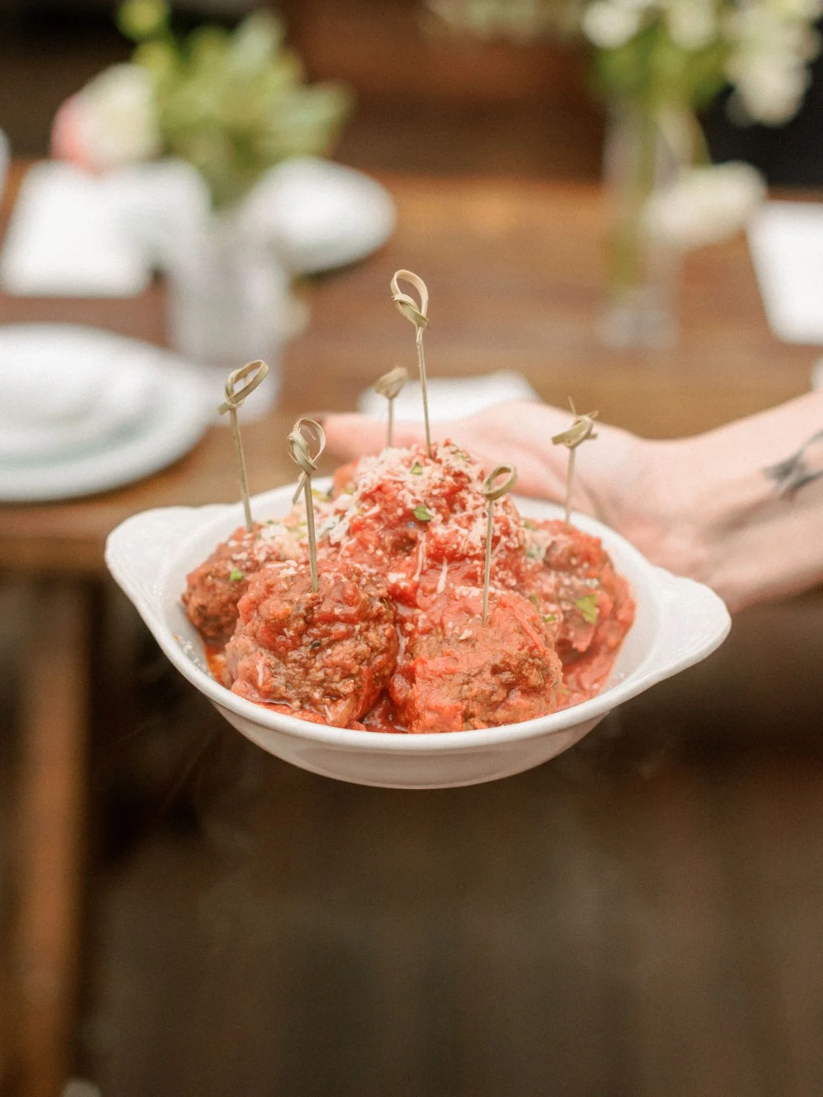  Hot, cheesy meatballs served with skewers—comfort food meets cocktail hour at this delicious  luxurious small intimate wedding .   