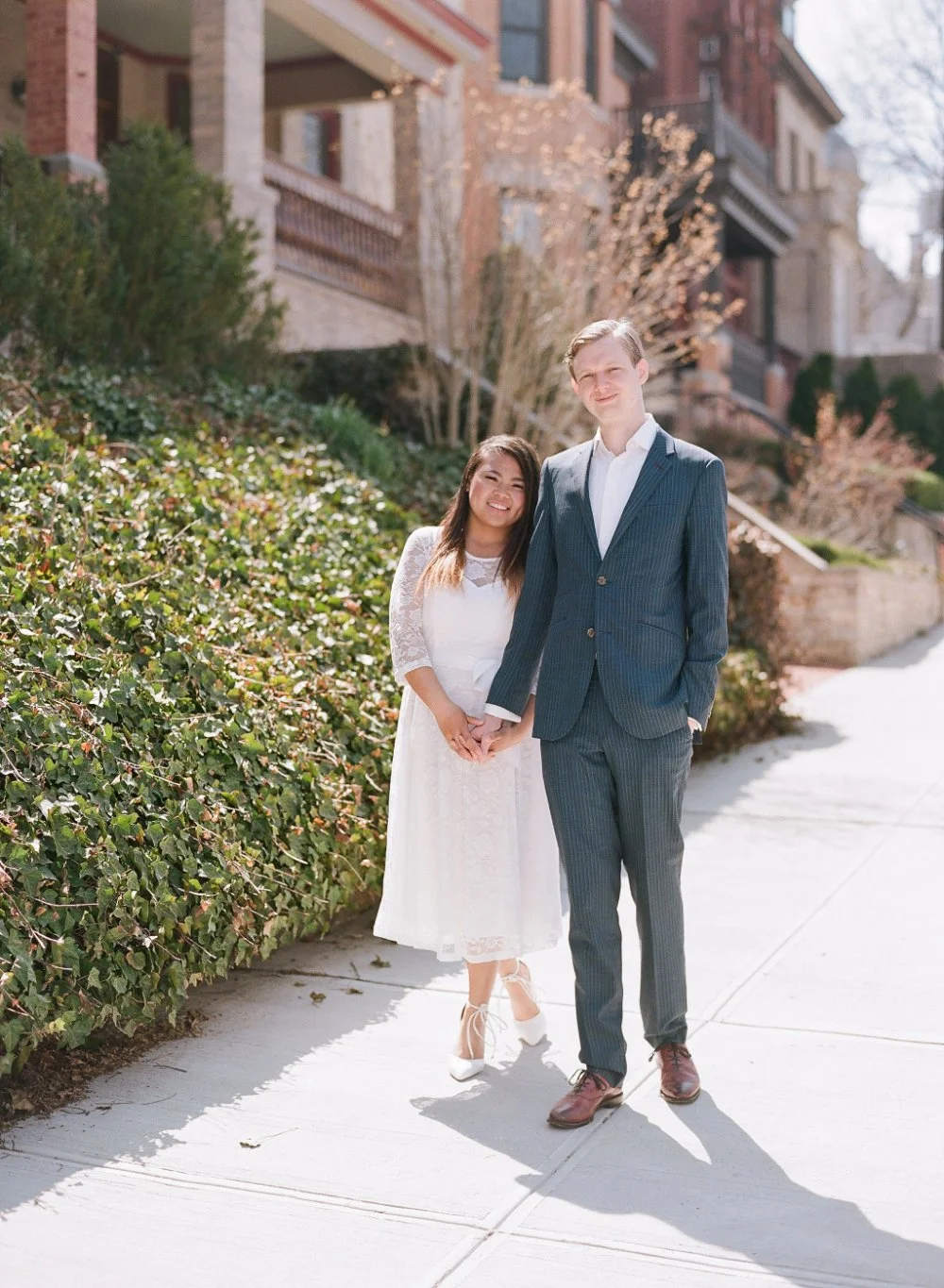 Romantic city engagement portrait featuring classic outfits and elegant what to wear for engagement photos ideas. 