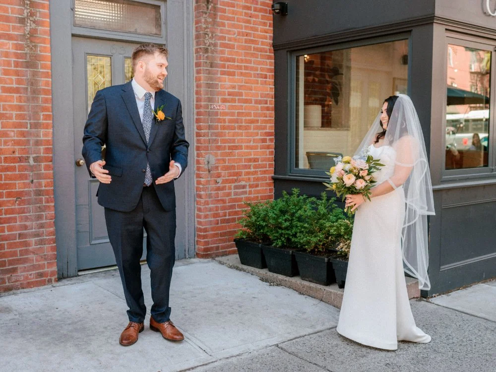  Bride approaching groom as he turns around for their emotional first meeting. 