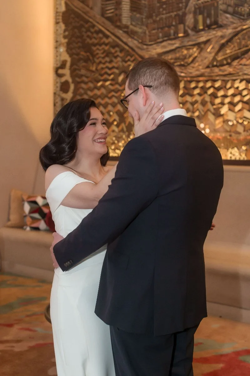 The couple shares an emotional first look, one of those tender, overlooked wedding moments filled with joy.