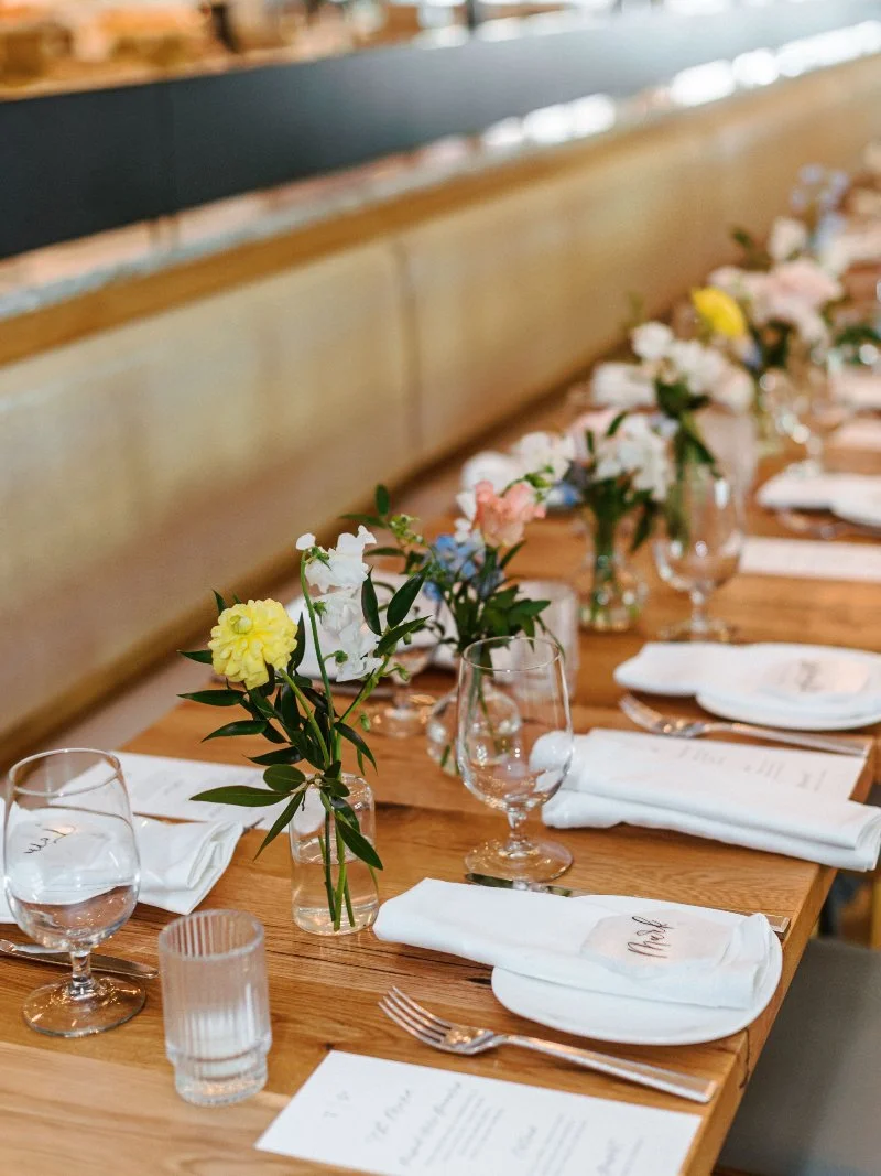 Intimate spring wedding in New Jersey table with soft florals, simple place settings, and warm natural light