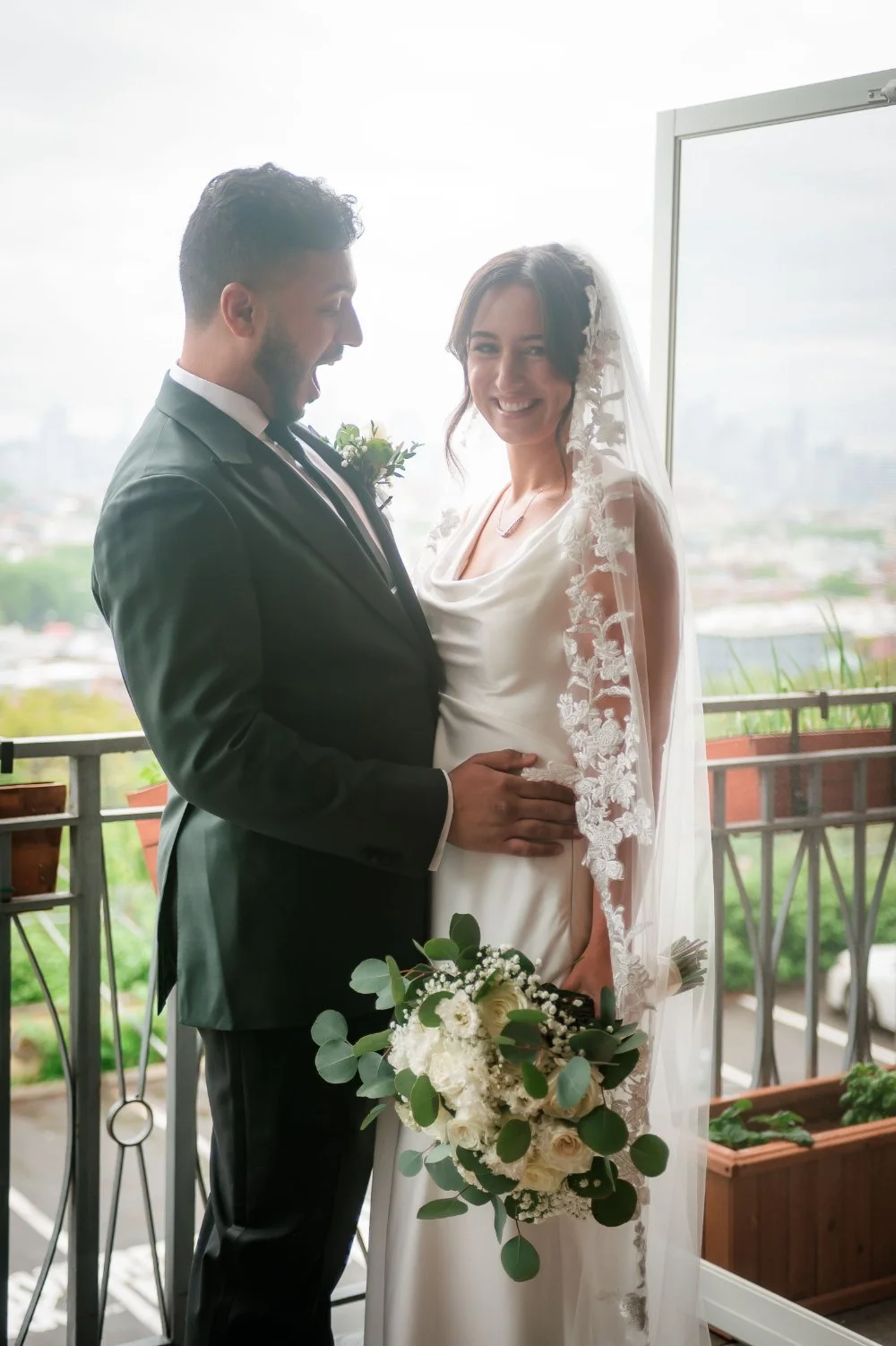 Bride and groom sharing a joyful reaction during a wedding first look ideas moment indoors.