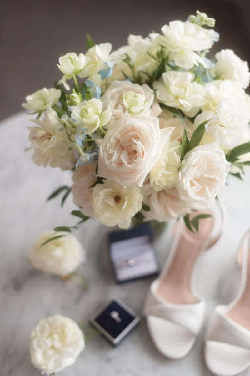 Soft blush and ivory bridal bouquet at small wedding venues in NJ with engagement ring.