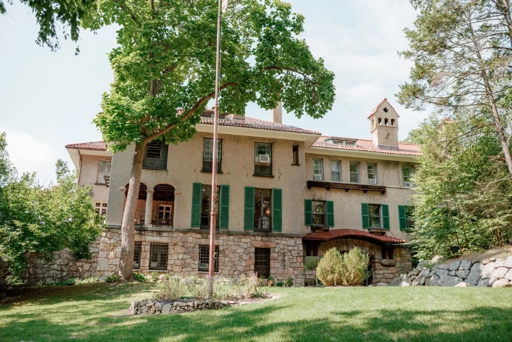 Arrow Park, nestled in nature, this historic estate with stone details and green shutters creates a serene micro wedding venue in NJ & NYC, ideal for couples seeking charm and tranquility.