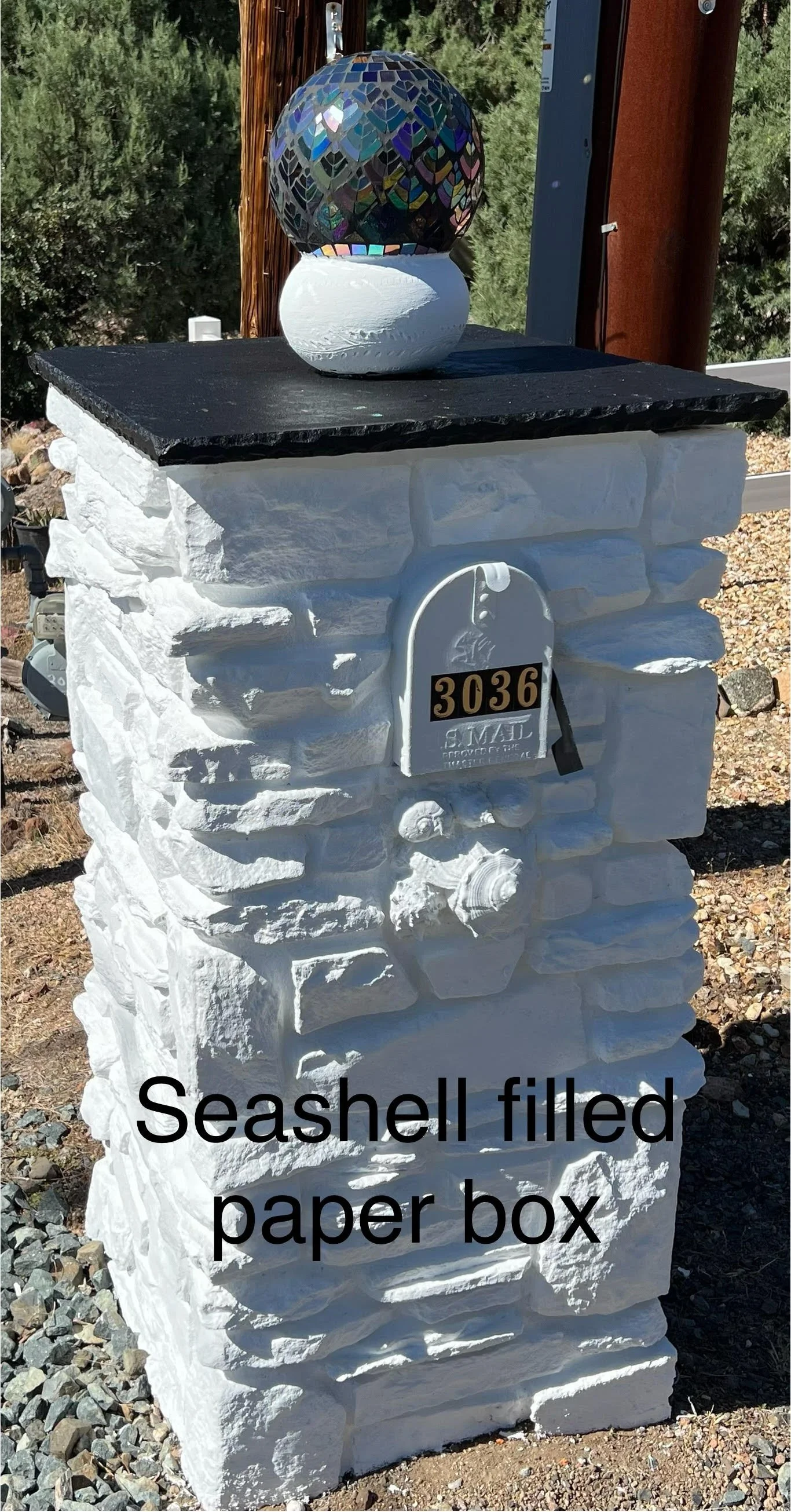 sealed off the newspaper hole with large seashells