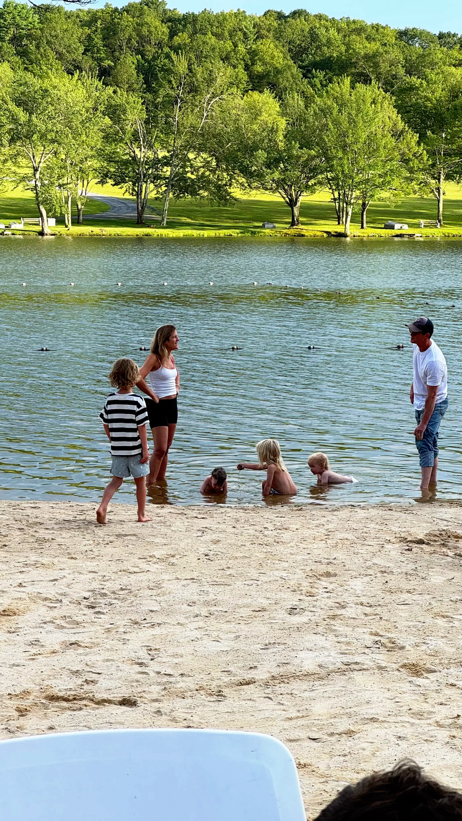 Families enjoying the beach and lake at Mountain Springs Lake Resort