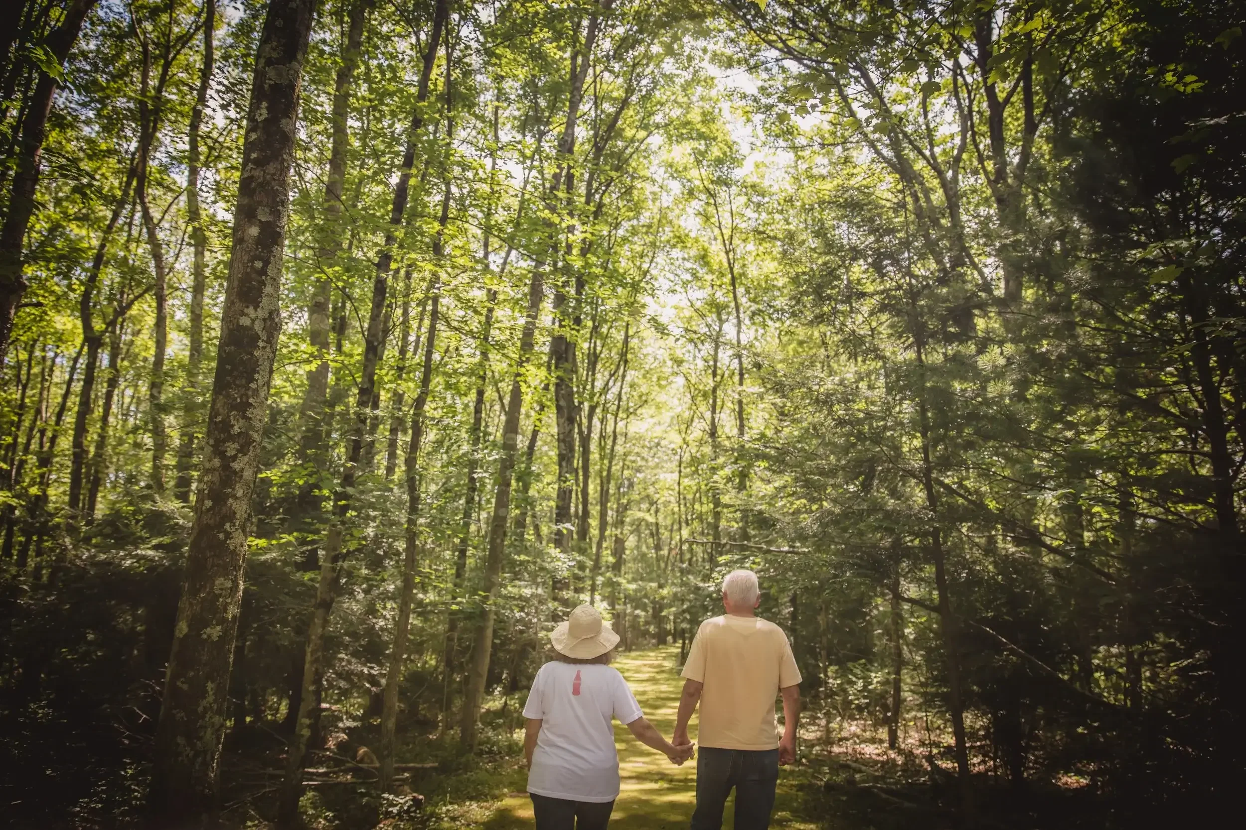 Couple walking wooded trails at Mountain Springs Lake Resort