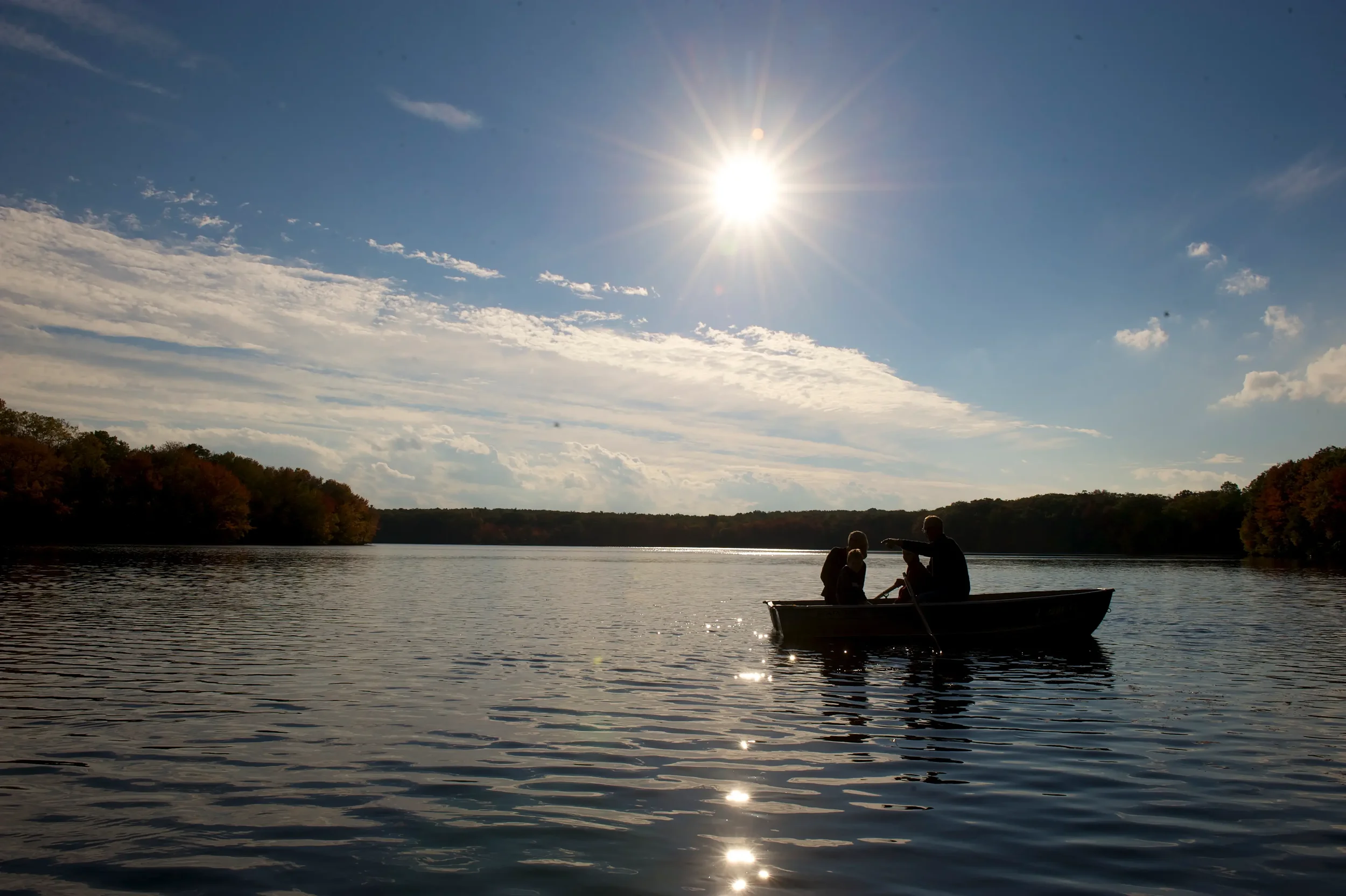Guests enjoying a peaceful rowboat ride on Mountain Springs Lake