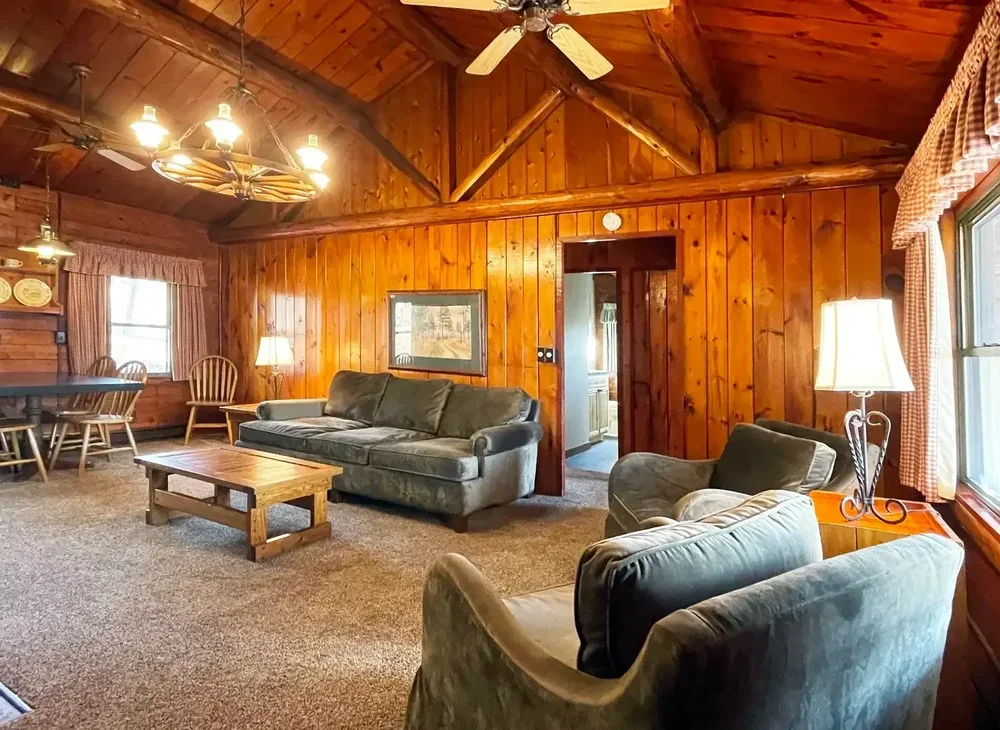 Floor plan showing two bedrooms, one bath, kitchen, living area, and covered porch.