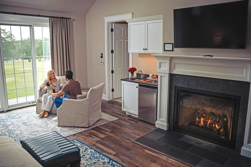 Couple relaxing in a Luxury Suite with a fireplace