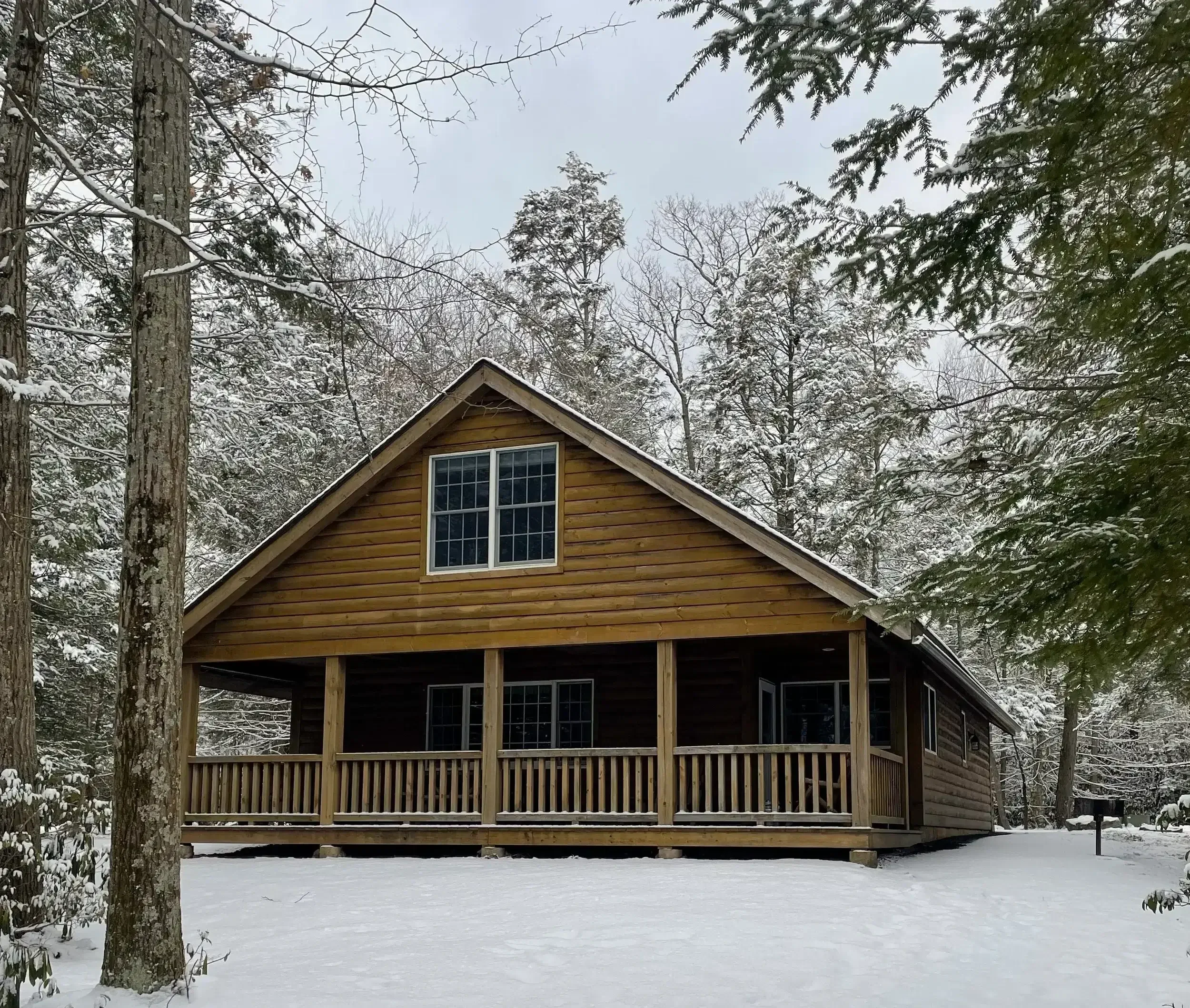 Snow-covered Poconos cabin near Camelback Mountain at Mountain Springs Lake Resort.