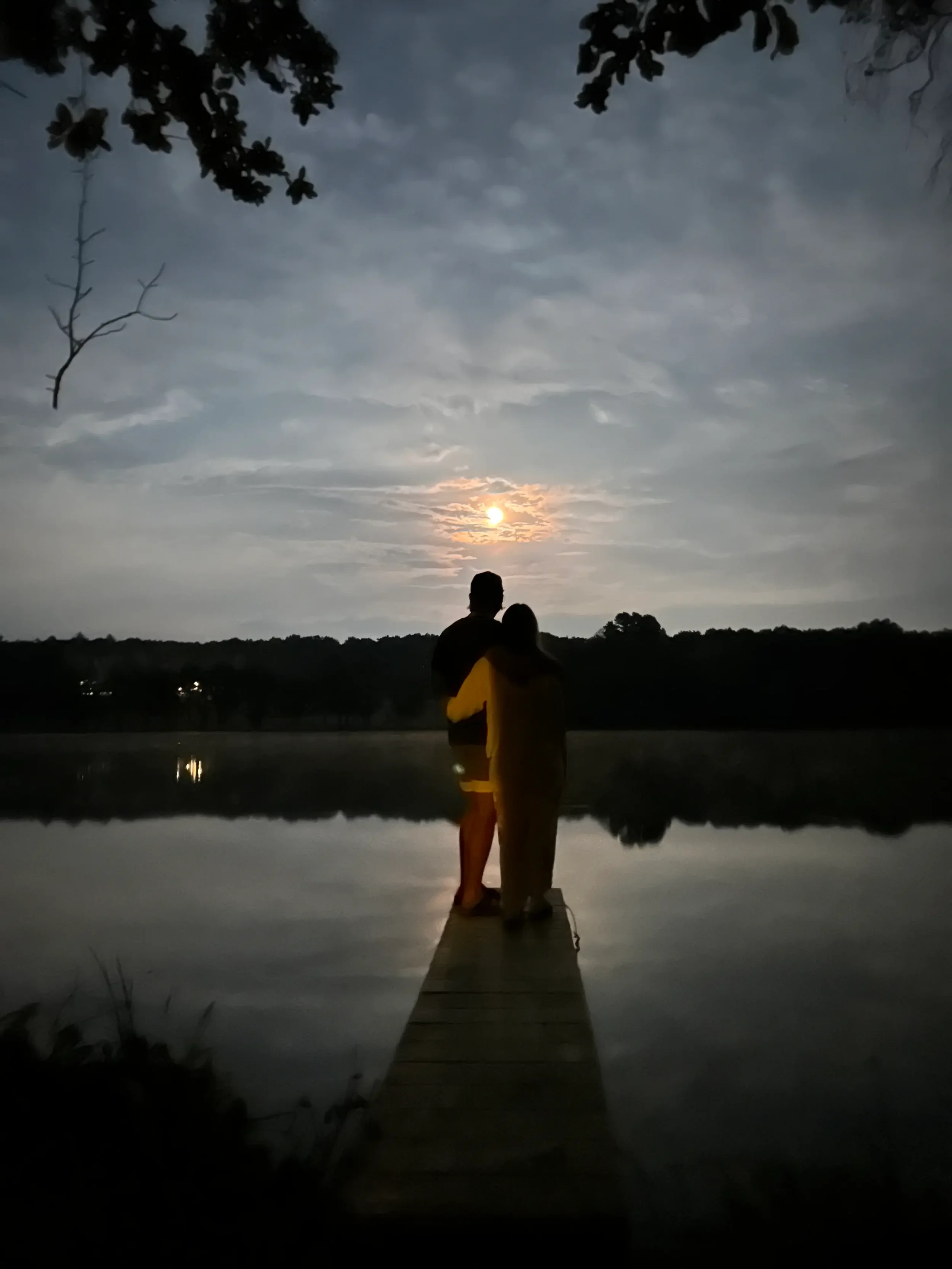 Couple enjoying a peaceful lakeside sunset near Kalahari at Mountain Springs Lake Resort