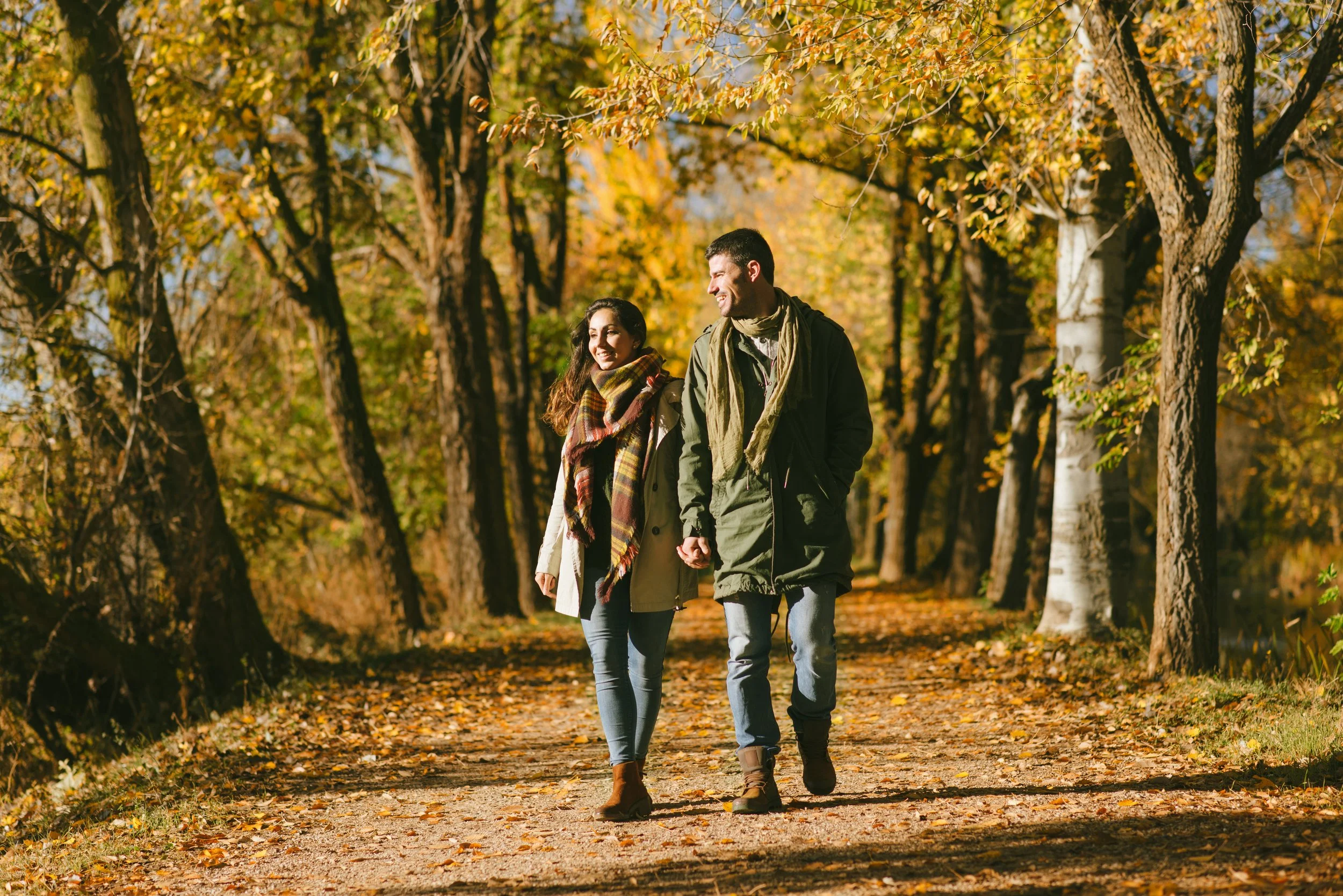 Couple walking wooded trails during fall at Mountain Springs Lake Resort
