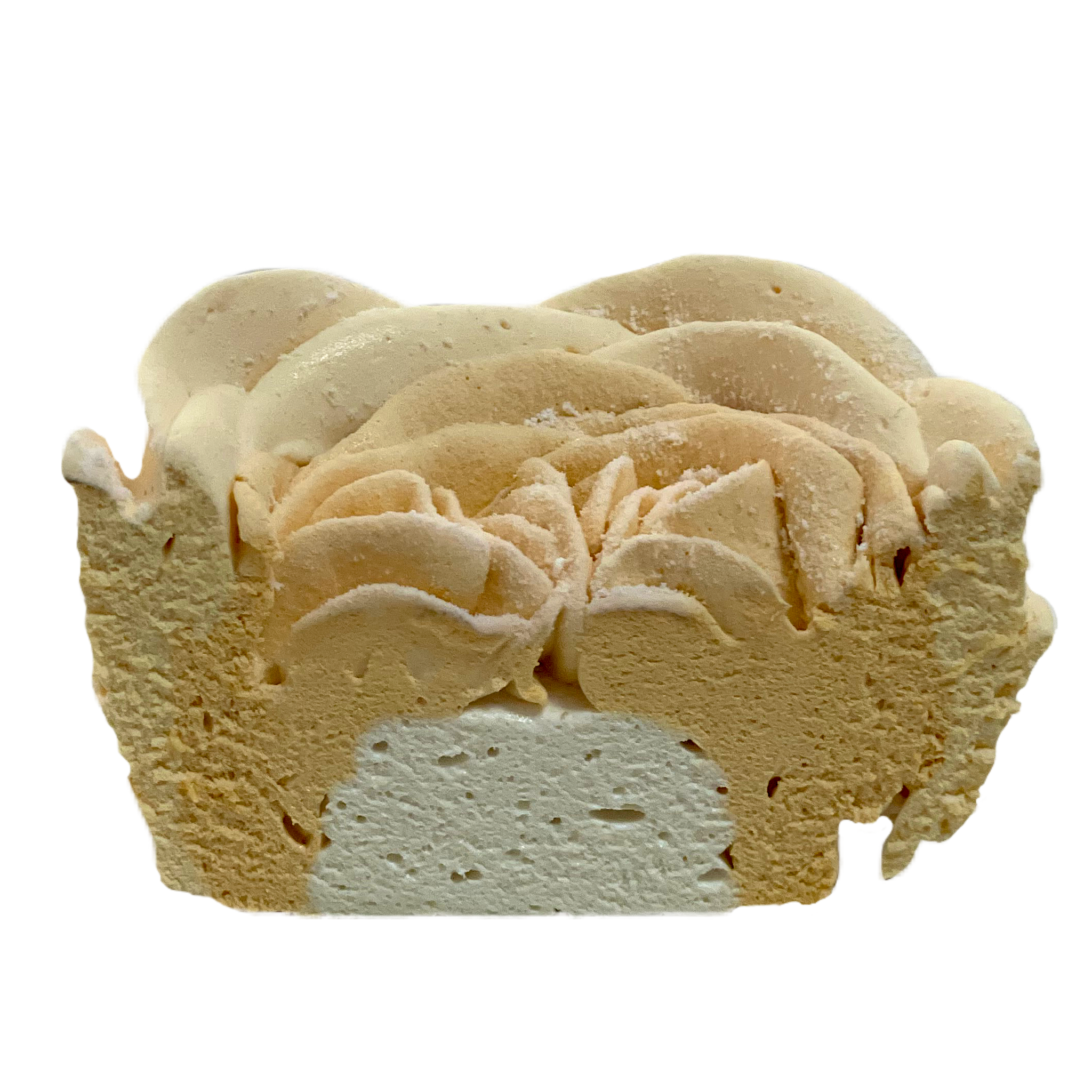 A slice of cheesecake with a thick, creamy texture, topped with swirls of beige and white whipped cream or frosting.