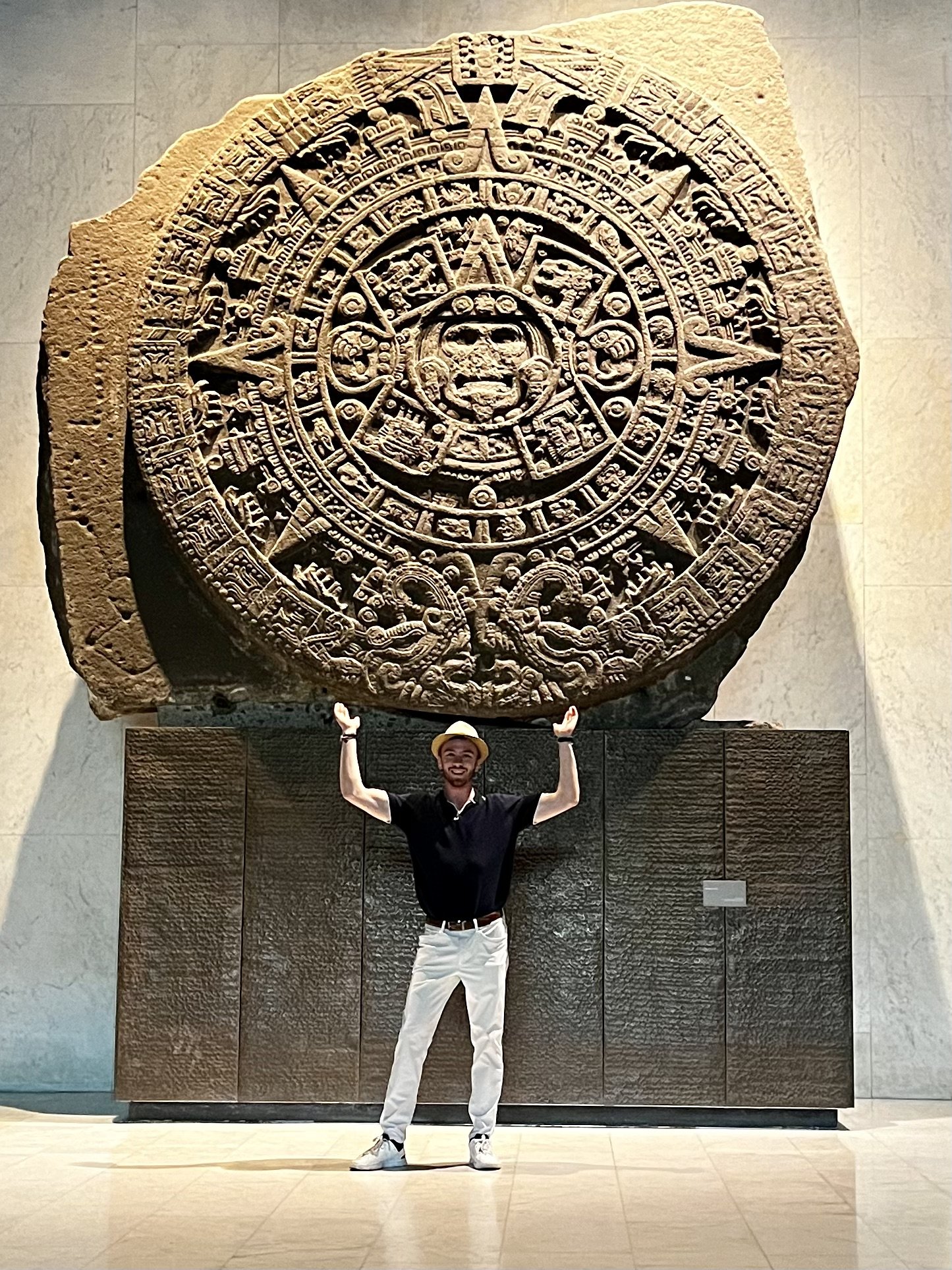Holding up an Aztec sundial -- it was very heavy!