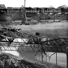 Manchester United's famed Old Trafford sits in ruins, bombed by German air forces during WWII and a hiatus for World Cup matches.