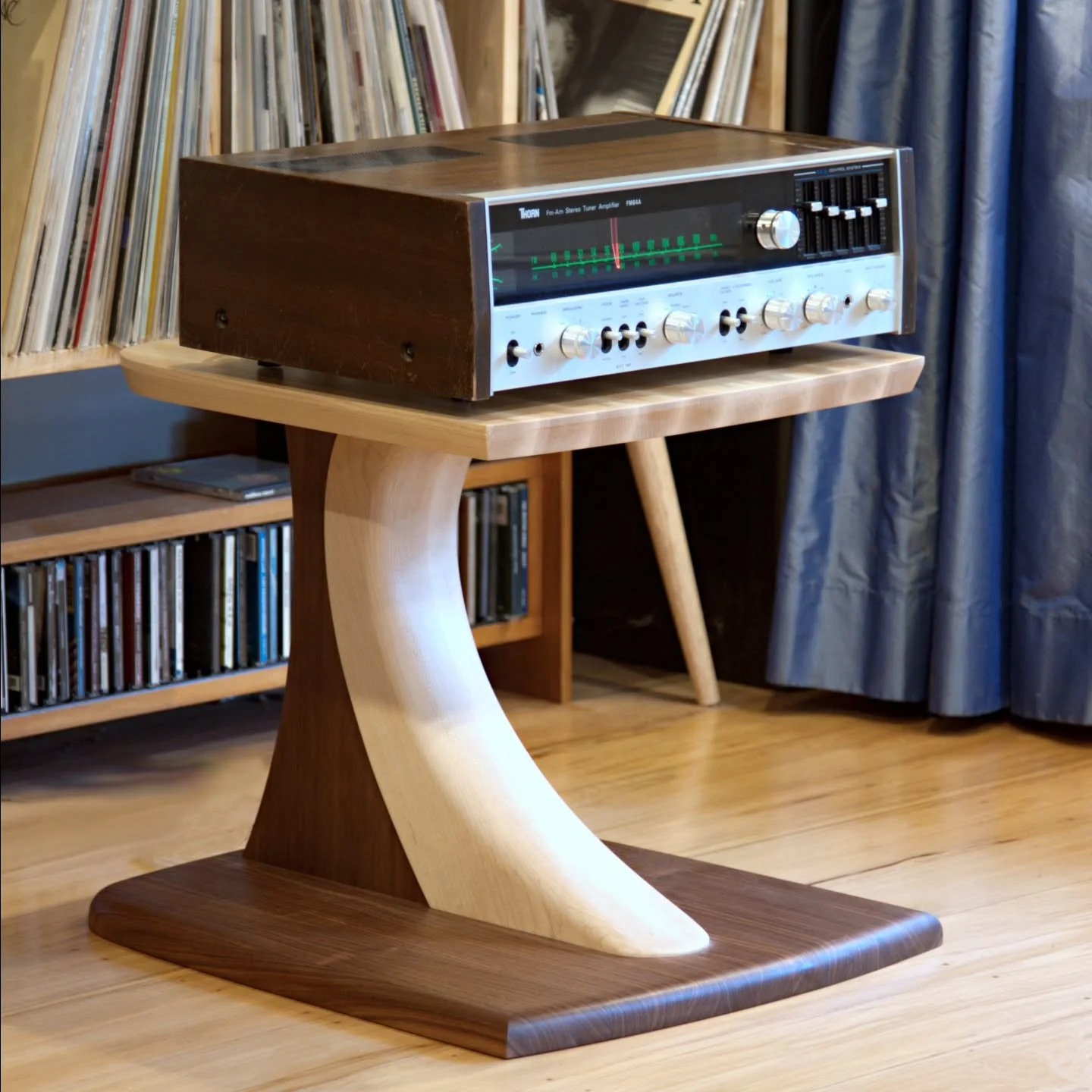 A set of two custom HiFi component stands for my client Phil. 

Statement pieces designed to complement his existing loudspeakers. 

The pedestal leg has a dramatic curve and robustly supports the solid maple shelf/shelves. Cable management runs in a