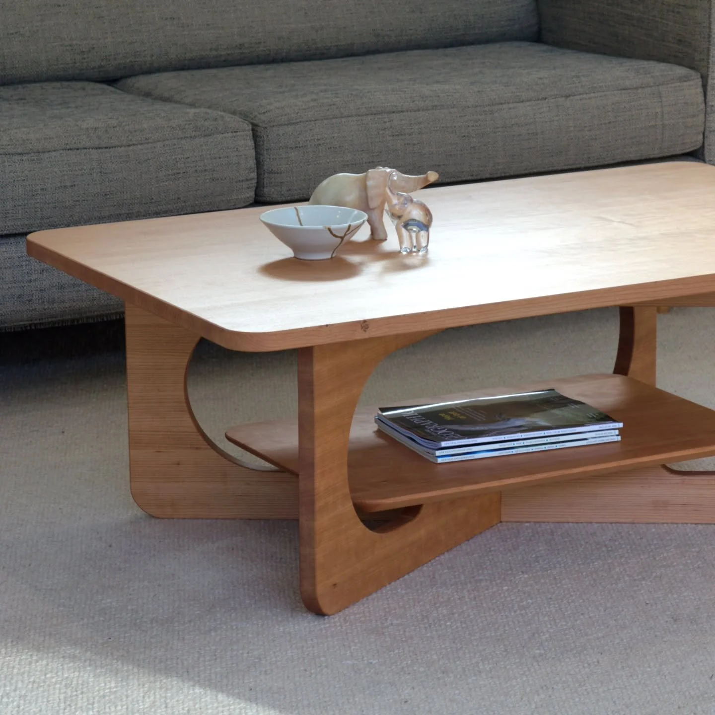 Coffee table in cherry (such a lovely timber). This one's off to its new home in Wellington.

Diagonally crossed legs, radius cutouts and corners, with a floating shelf.

#nzdesign #furnituremaker #coffeetable #handmade #customfurniture