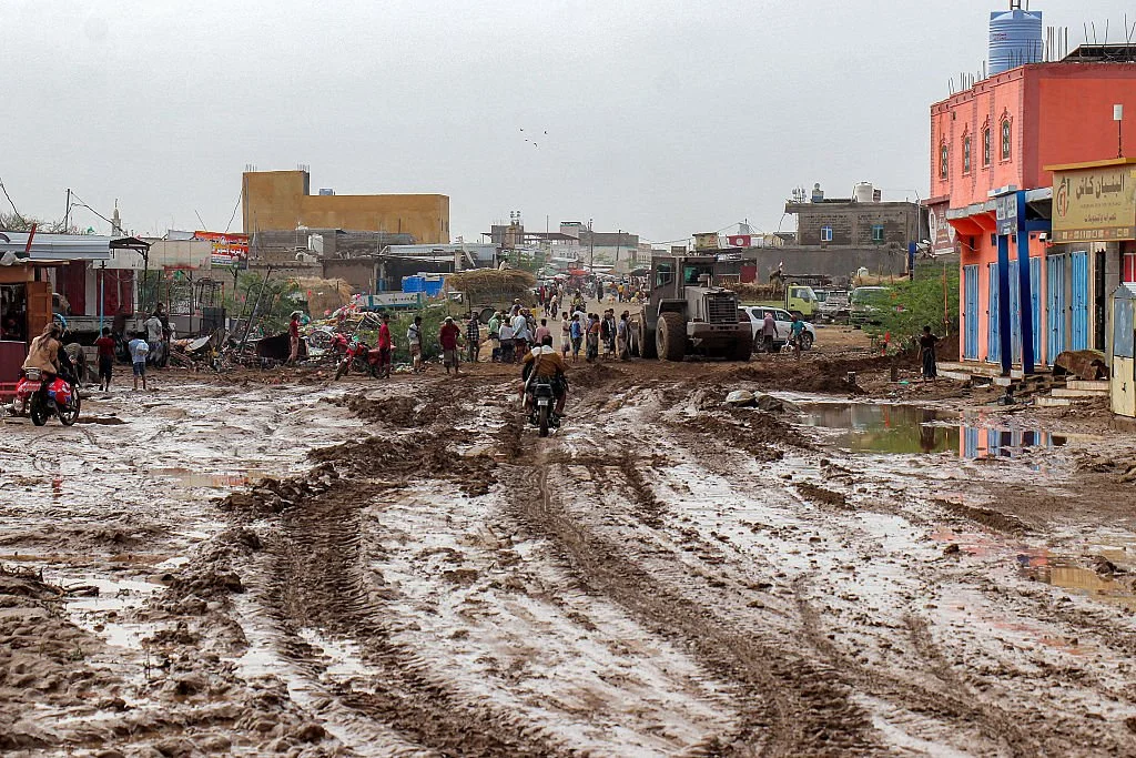 A bulldozer clearing a muddy road in an area devastated by recent flash floods in Yemen's western city of Mokha, Taiz on March 28, 2026 Khaled Ziad AFP via Getty Images