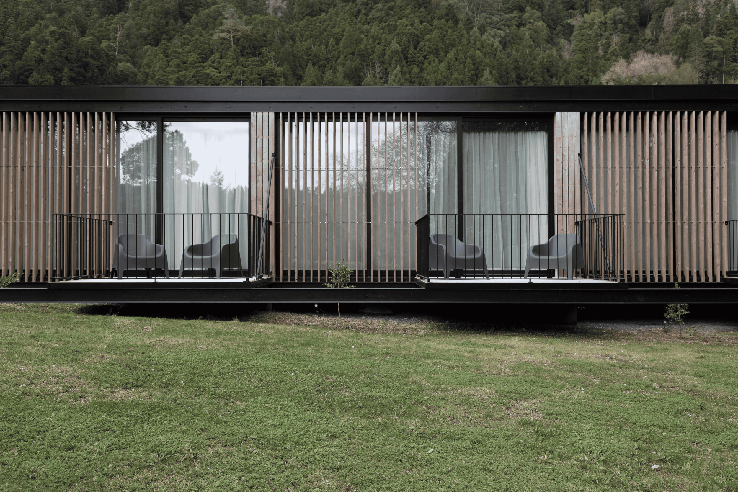 salworks-modern-timber-house-forest-stilts-azores-architecture-wood-balcony.png