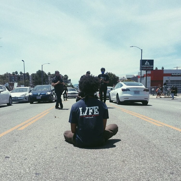 Kio+Briggs+Meditating+at+Los+Angeles+Protests+2020+(1).jpeg