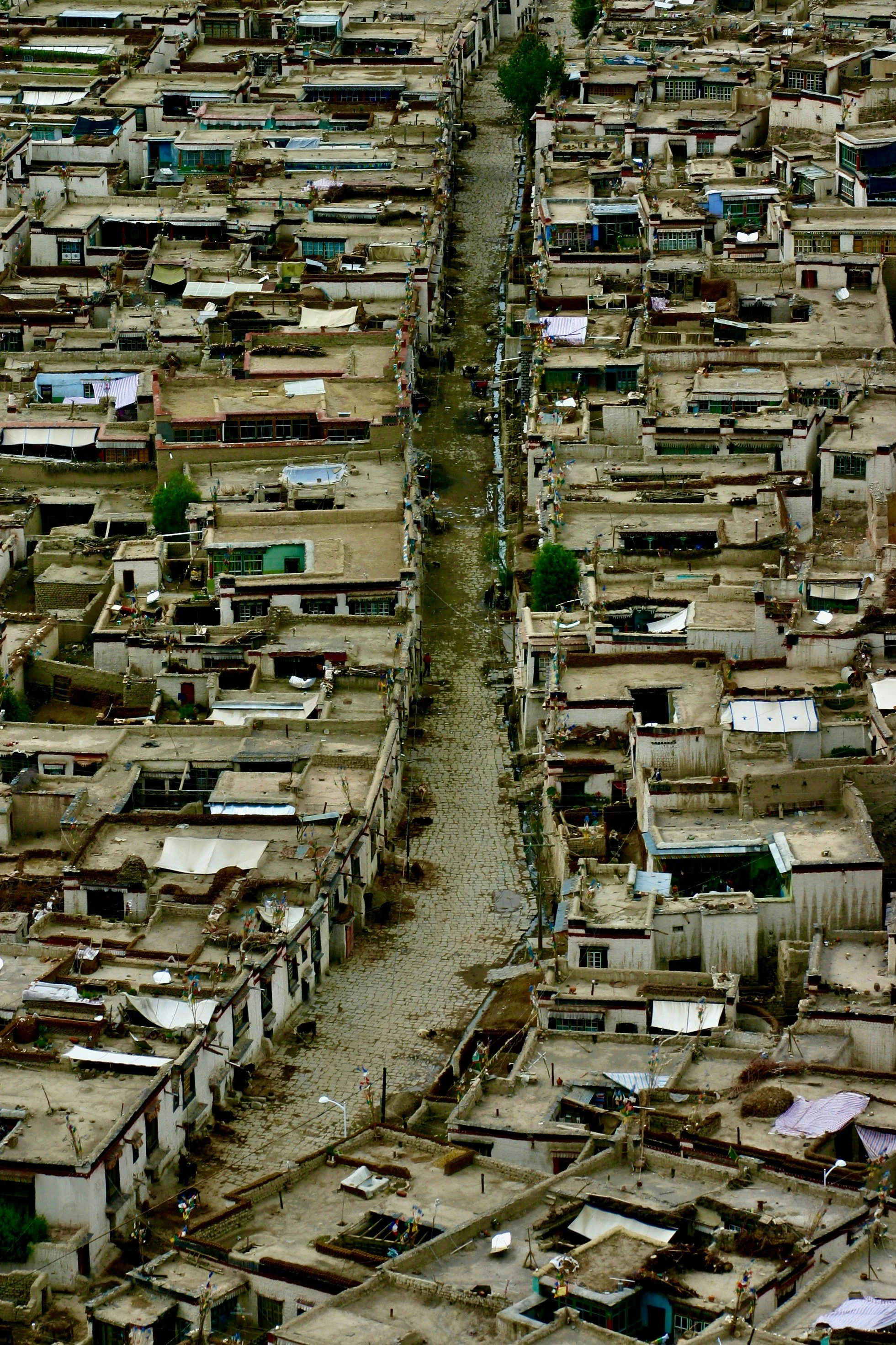 Aerial view of small and crumbling city buildings during daytime