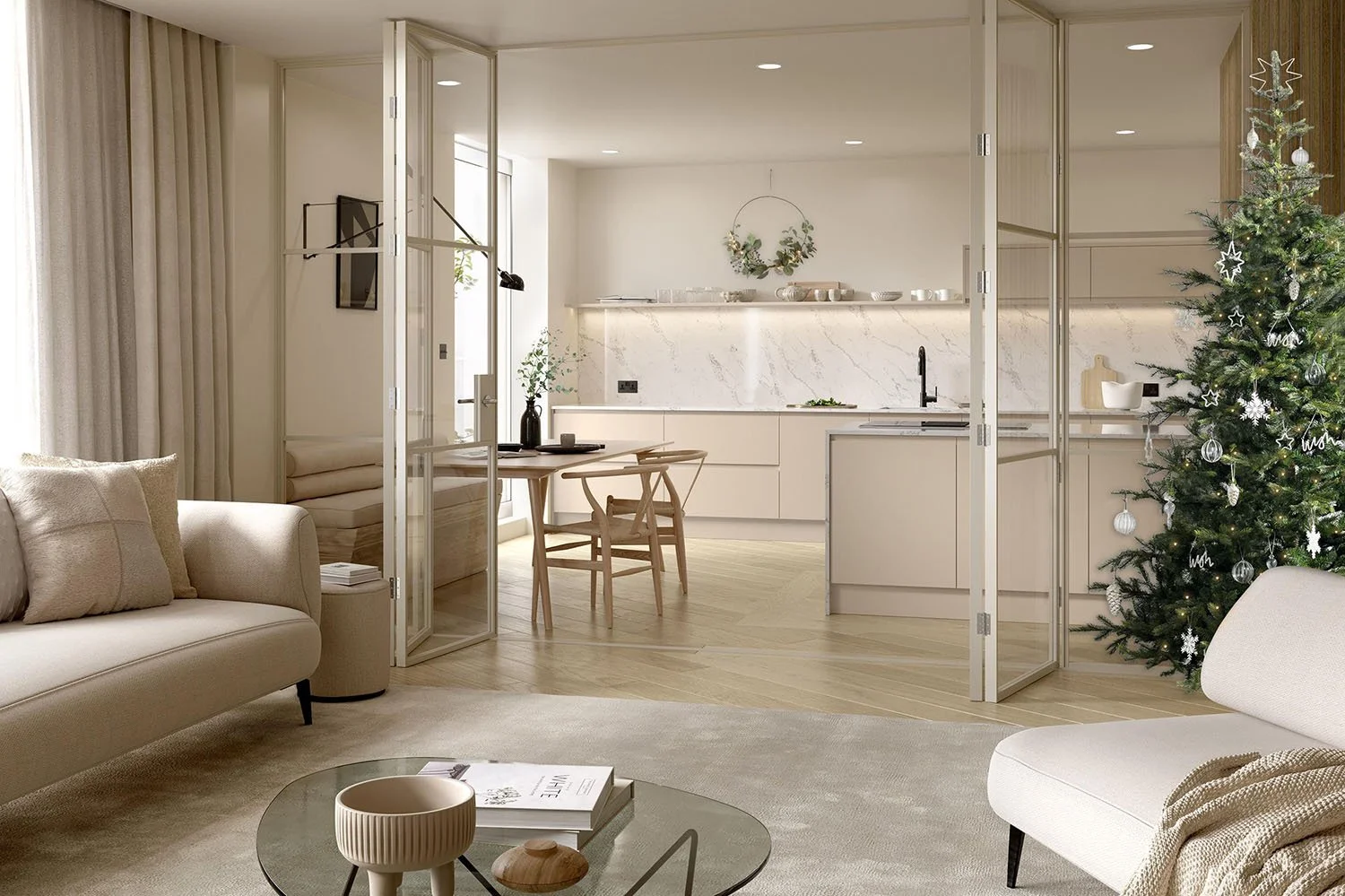 Living room with beige sofas, a glass coffee table, a decorated Christmas tree, and an open kitchen with white cabinets and a marble backsplash.