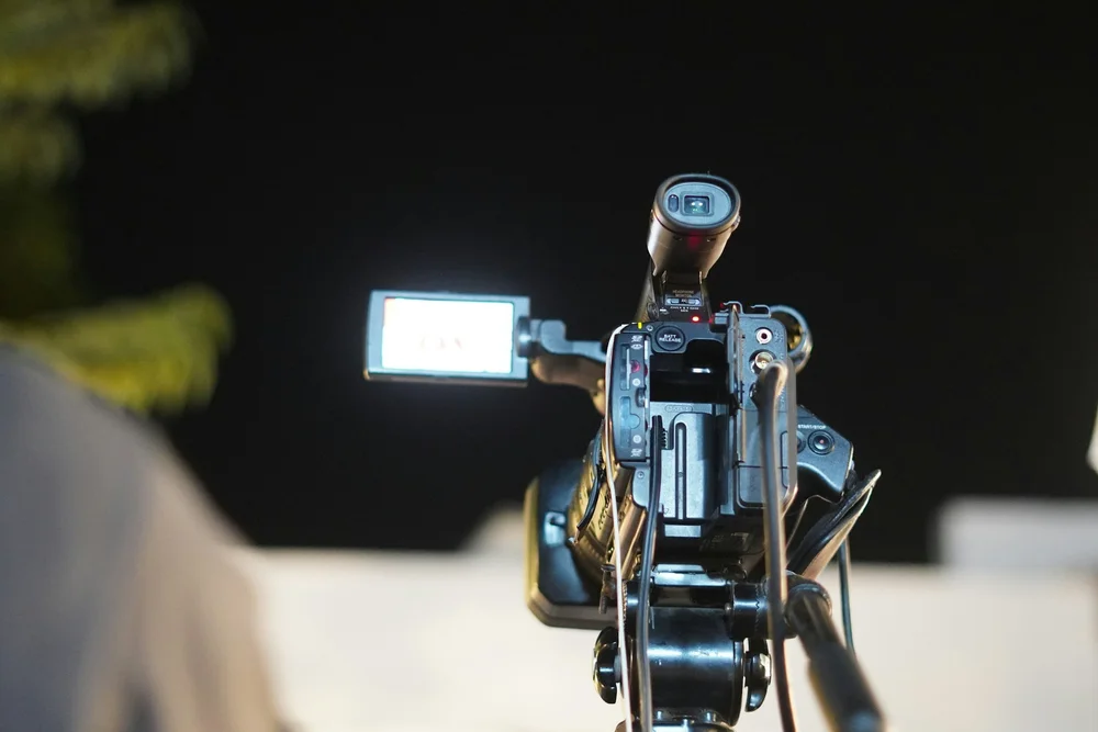 Professional video camera filming a live event