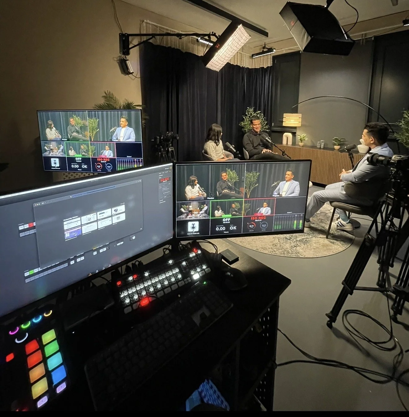 Podcast production setup at our London studio showing multi-camera video monitoring and recording equipment.