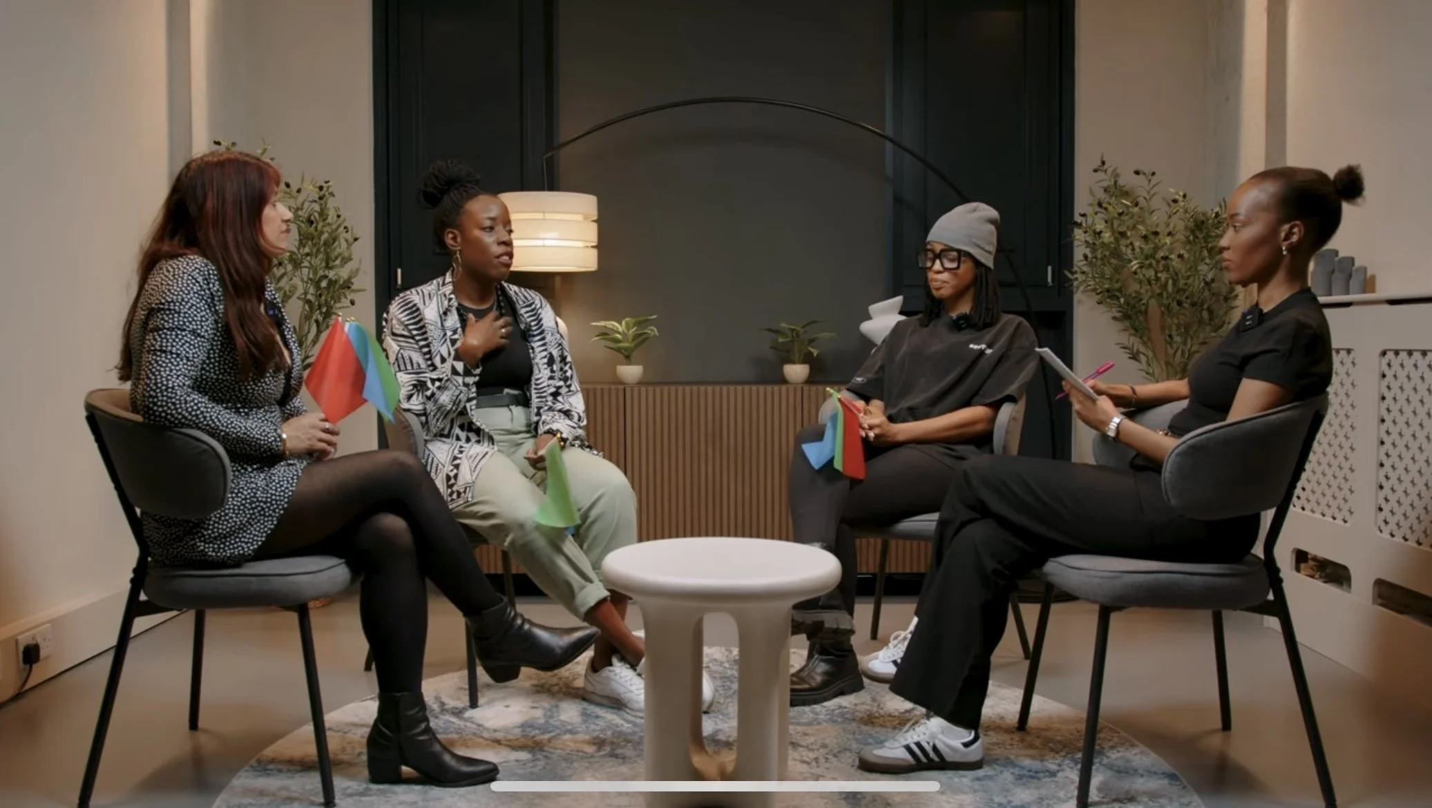 Four guests in conversation during a group podcast recording at our London podcast studio.