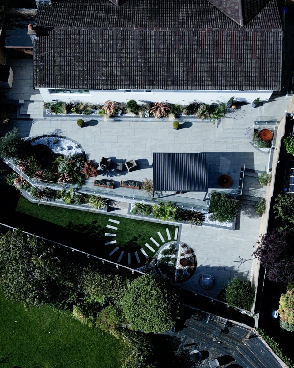 Professionally landscaped garden with contemporary outdoor living areas