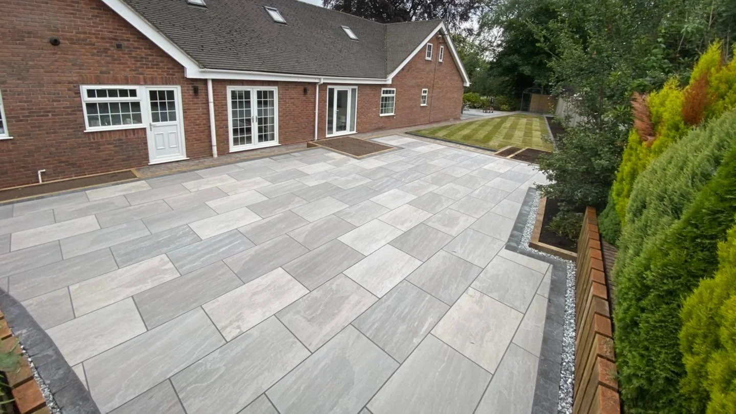 new patio and parking area for car with fence panels in Staffordshire
