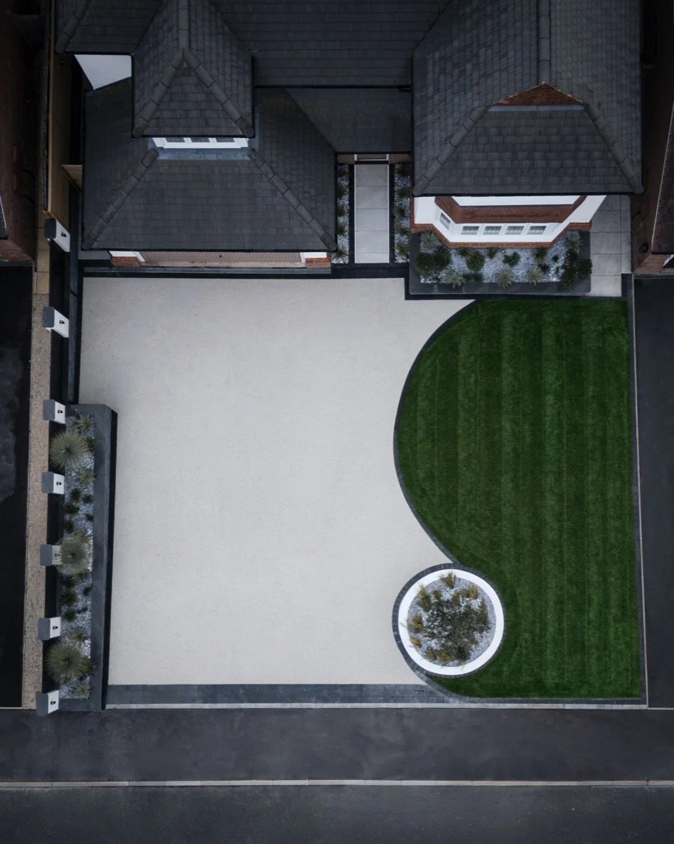 High-quality driveway landscaping with decorative planting and a contemporary front garden design.