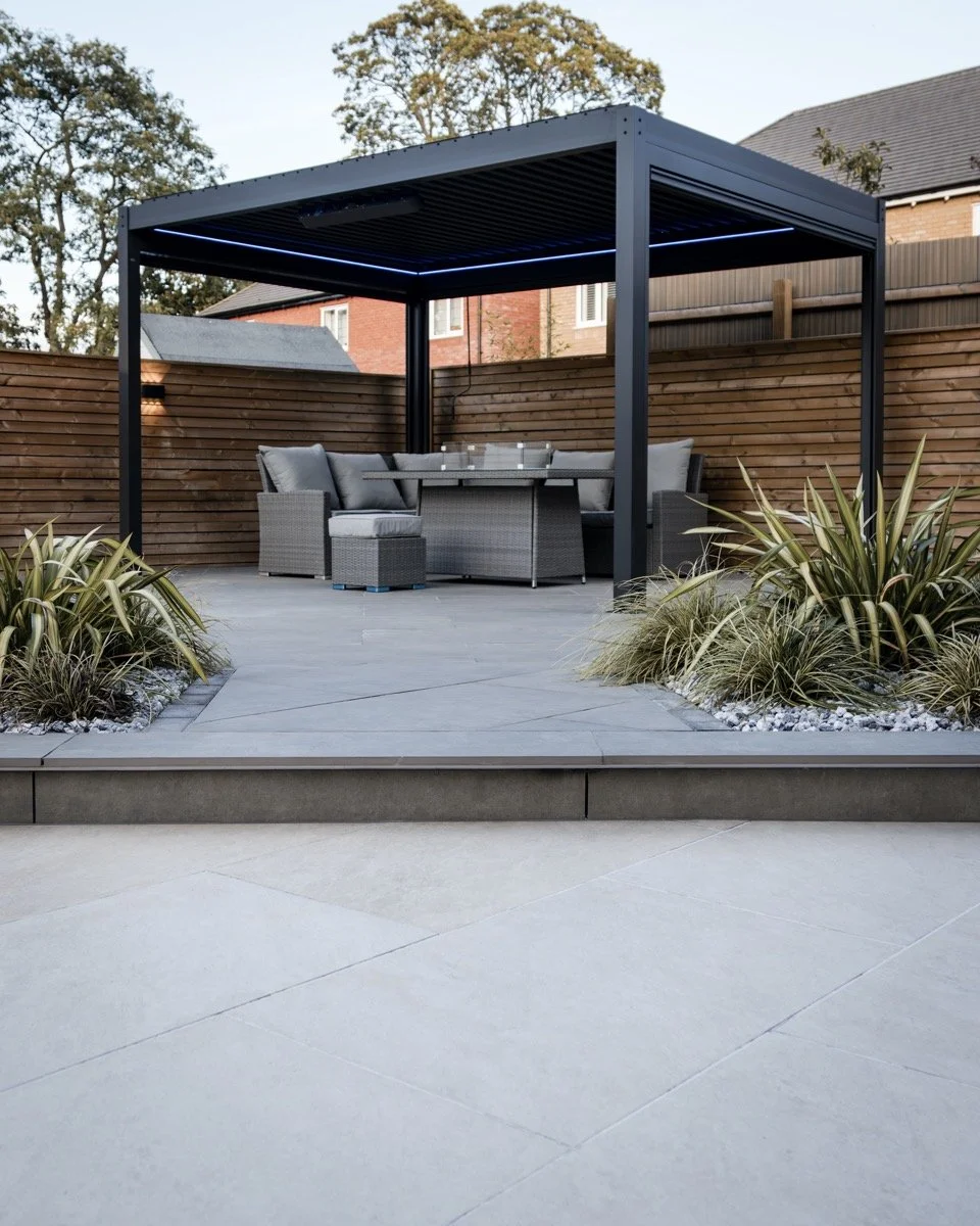 Stylish outdoor entertaining space with contemporary pergola, integrated lighting and comfortable garden furniture.