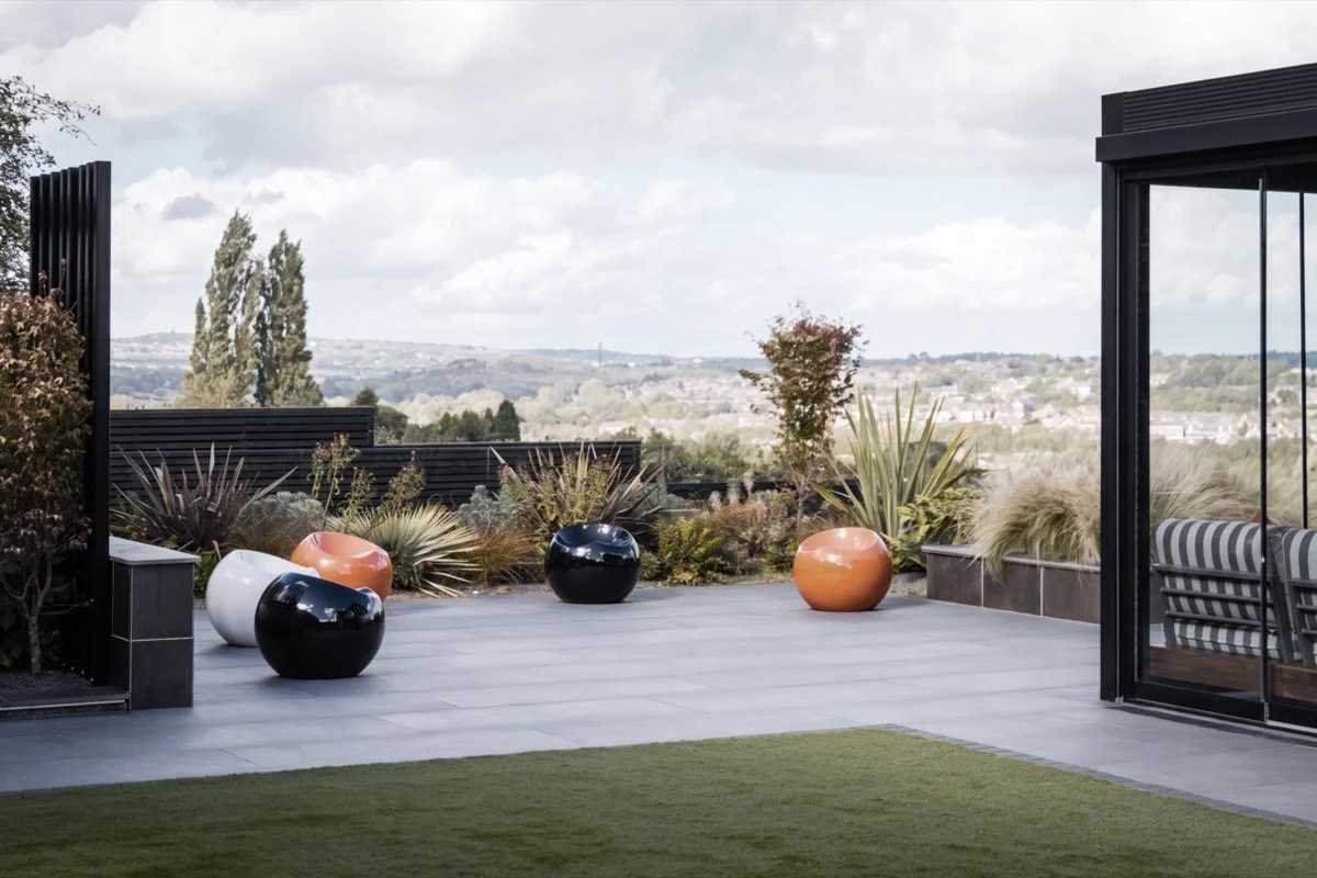 Professionally landscaped garden with contemporary outdoor living areas