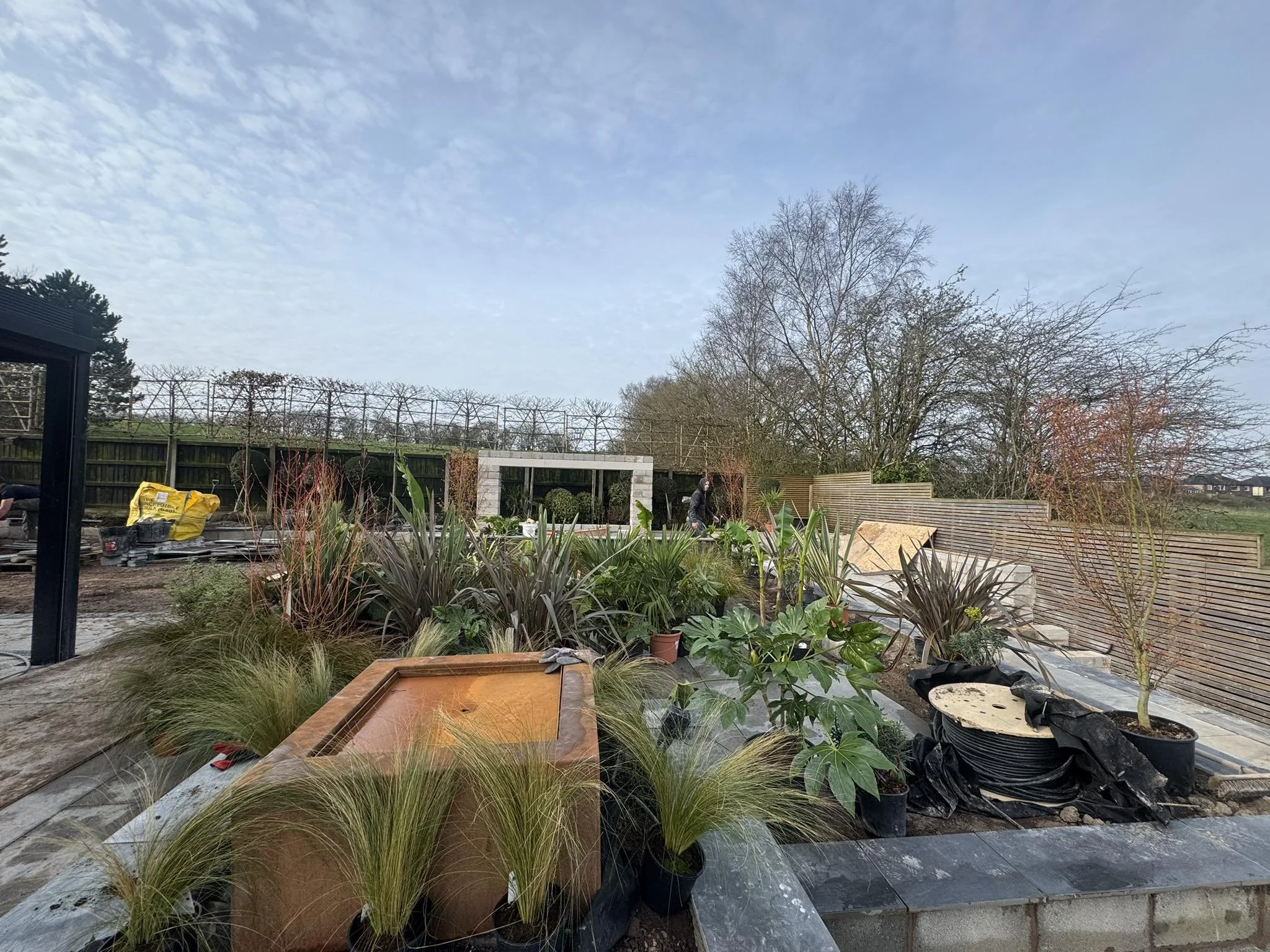 Garden landscaping project in Staffordshire showing patio installation and lawn preparation