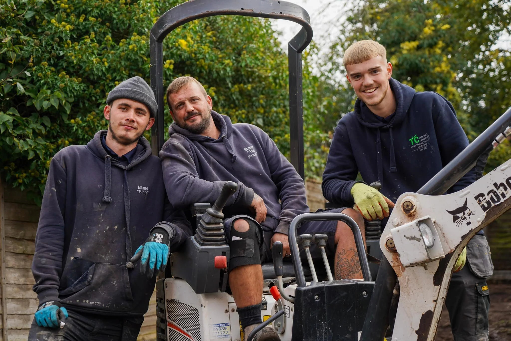 TC fencing and landscaping team in action on a project