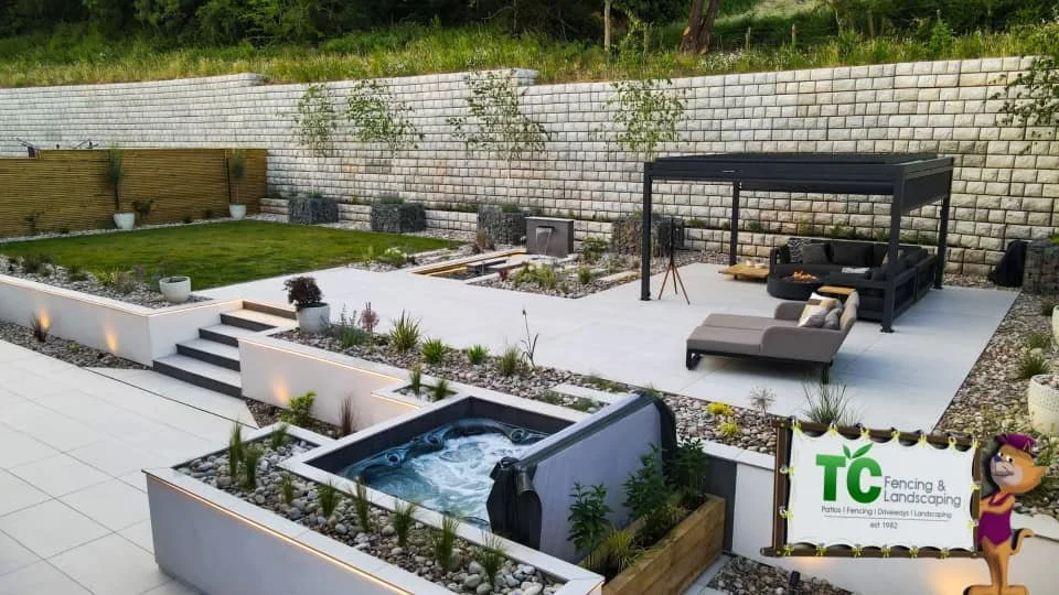 Top quality garden living space re construction with jacuzzi an fire pit