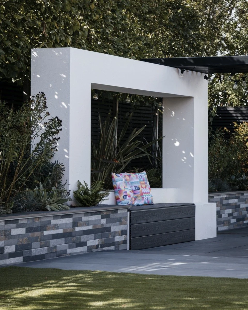 Luxury garden transformation featuring contemporary paving, bespoke landscaping and premium outdoor features.