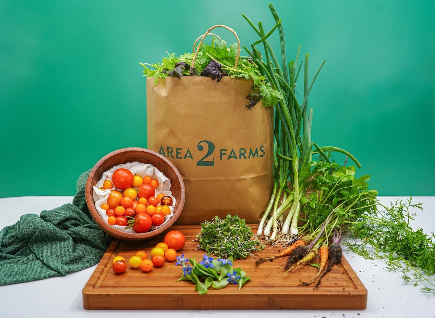 Enjoy freshly harvested kale, mild microgreen mix, tomatoes, borage flowers, and mirepoix.