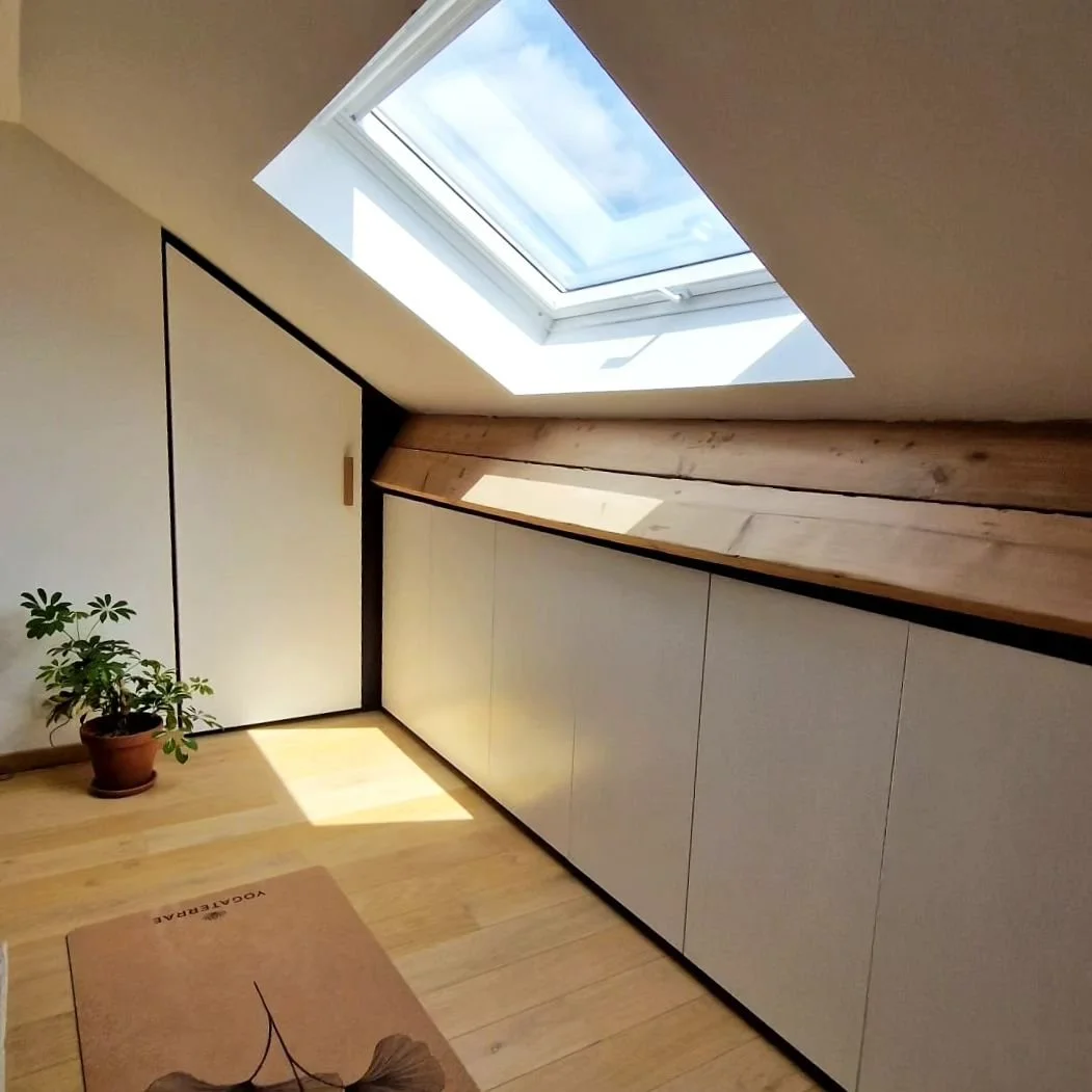 A happy customer just sent me some pictures of the custom built-in we installed a year ago in their attic.

The objective was to optimise storage space and tide-up the multifunctional room on the top floor.

Finishing around doors and frame in black 
