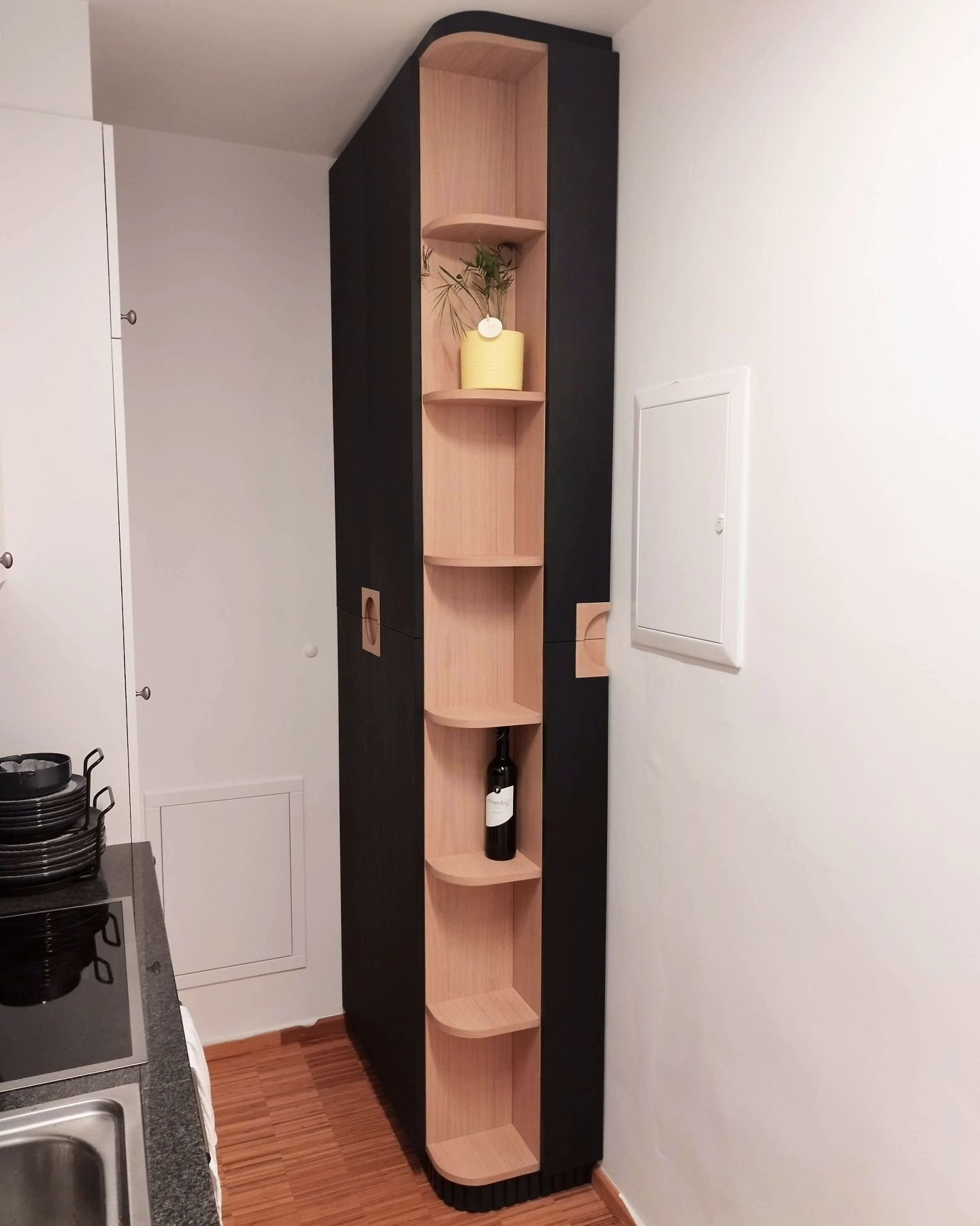 Exclusive kitchen extension for maximum and efficient storage with awesome custom-made handles.

A truly customised piece of furniture to fit into the space and nicely arrange household stuff in tailored compartments in the cabinet (waste sorting bin