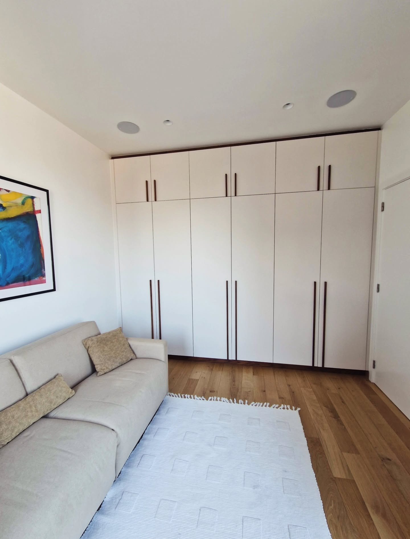 Built-In storage cabinets with Integrated Desk

Custom-designed cabinetry to maximize storage and organization in the guest room of a splendid penthouse in the heart of Brussels &mdash; offering a stunning view over the Grand Place and Manneken Pis ?