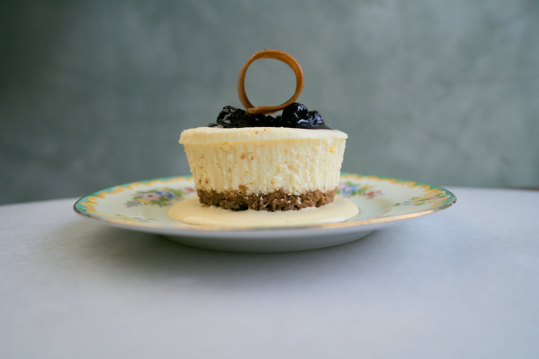 Homemade cheesecake in a plate with fruit on the top