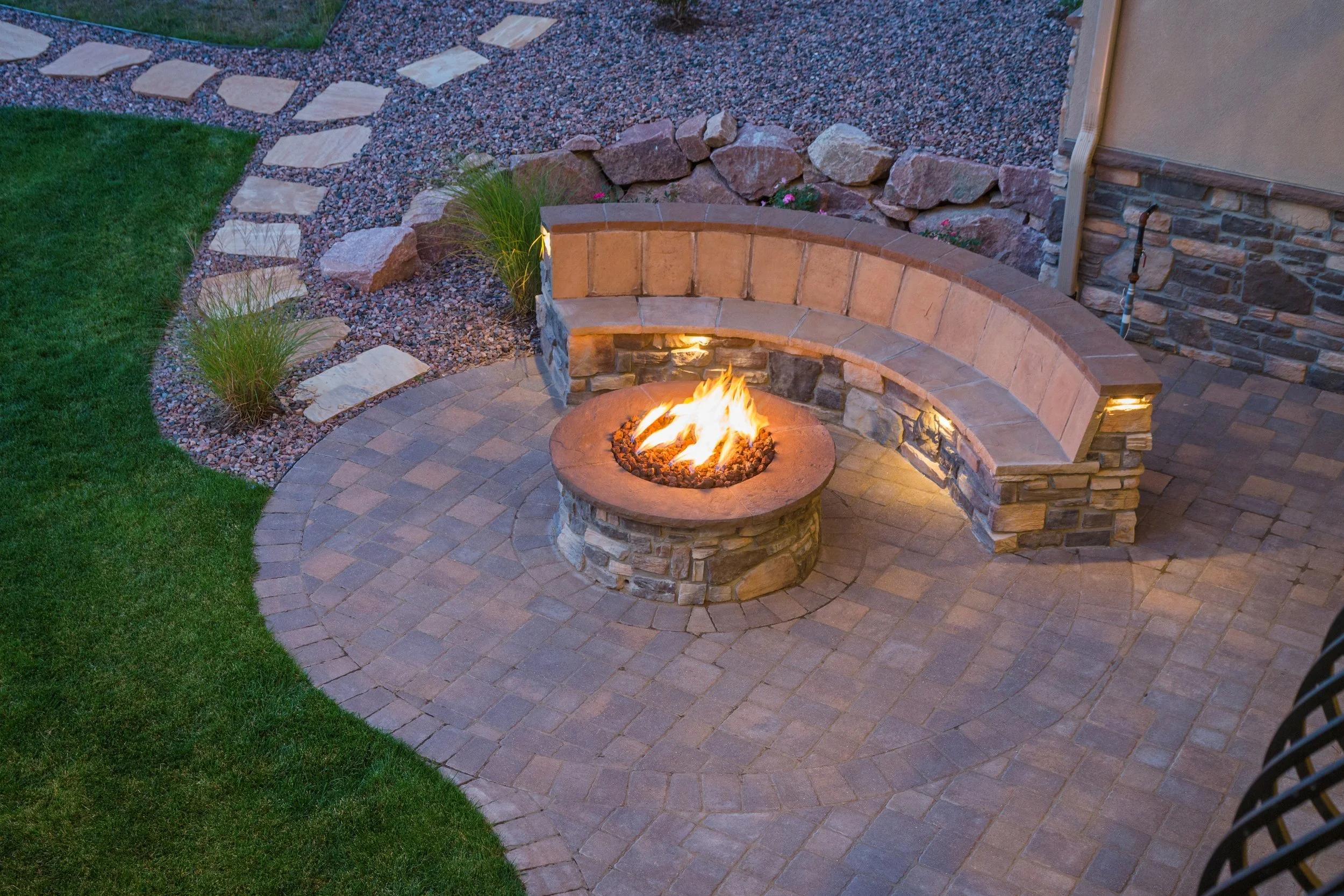 Fire pit with seating wall installation in Delaware