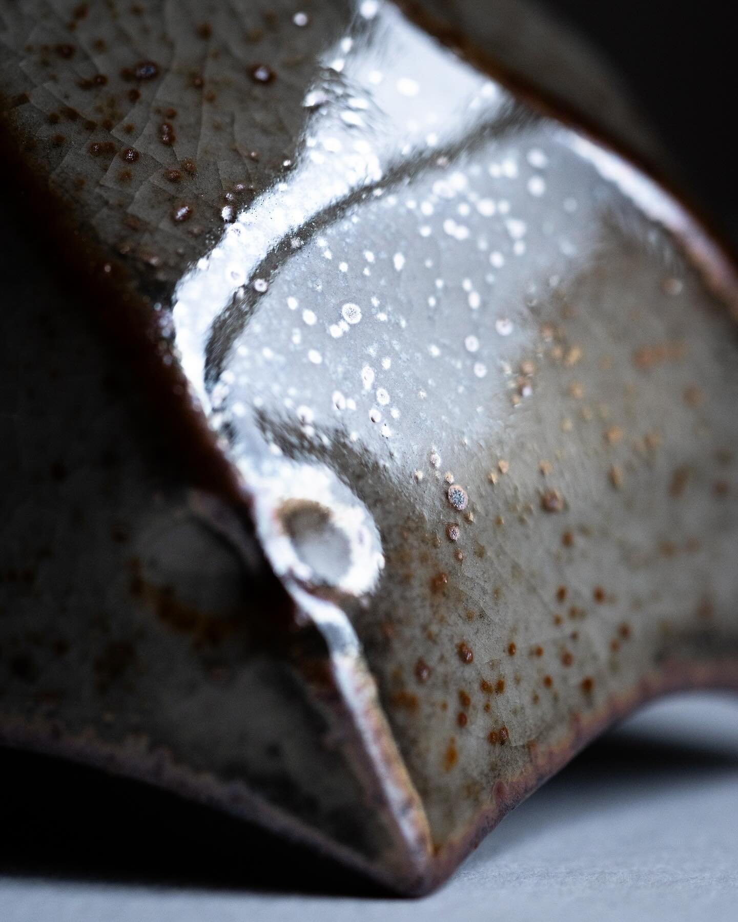 Details of a few shino-glazed faceted bowls full of glittery reflective iron speckles, intricate crazing, and gradients of grey carbon trapping. These bowls will be part of my online shop update tomorrow! A full preview of the shop update is availabl