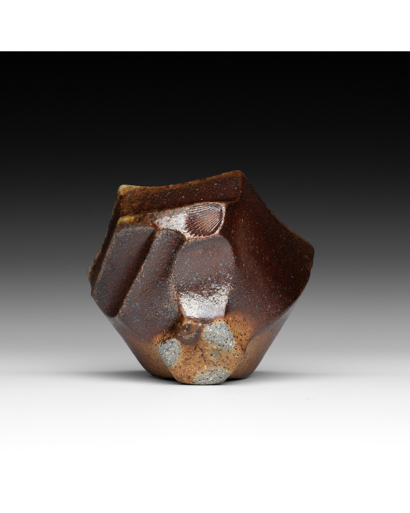 A tiny faceted bowl with gradients of burgundy/brown flashing, golden wood ash, and a speckled shino-glazed interior. The rich earthy tones of this piece remind me of the distinct bark of madrone trees and duff on a forest floor. This bowl is availab