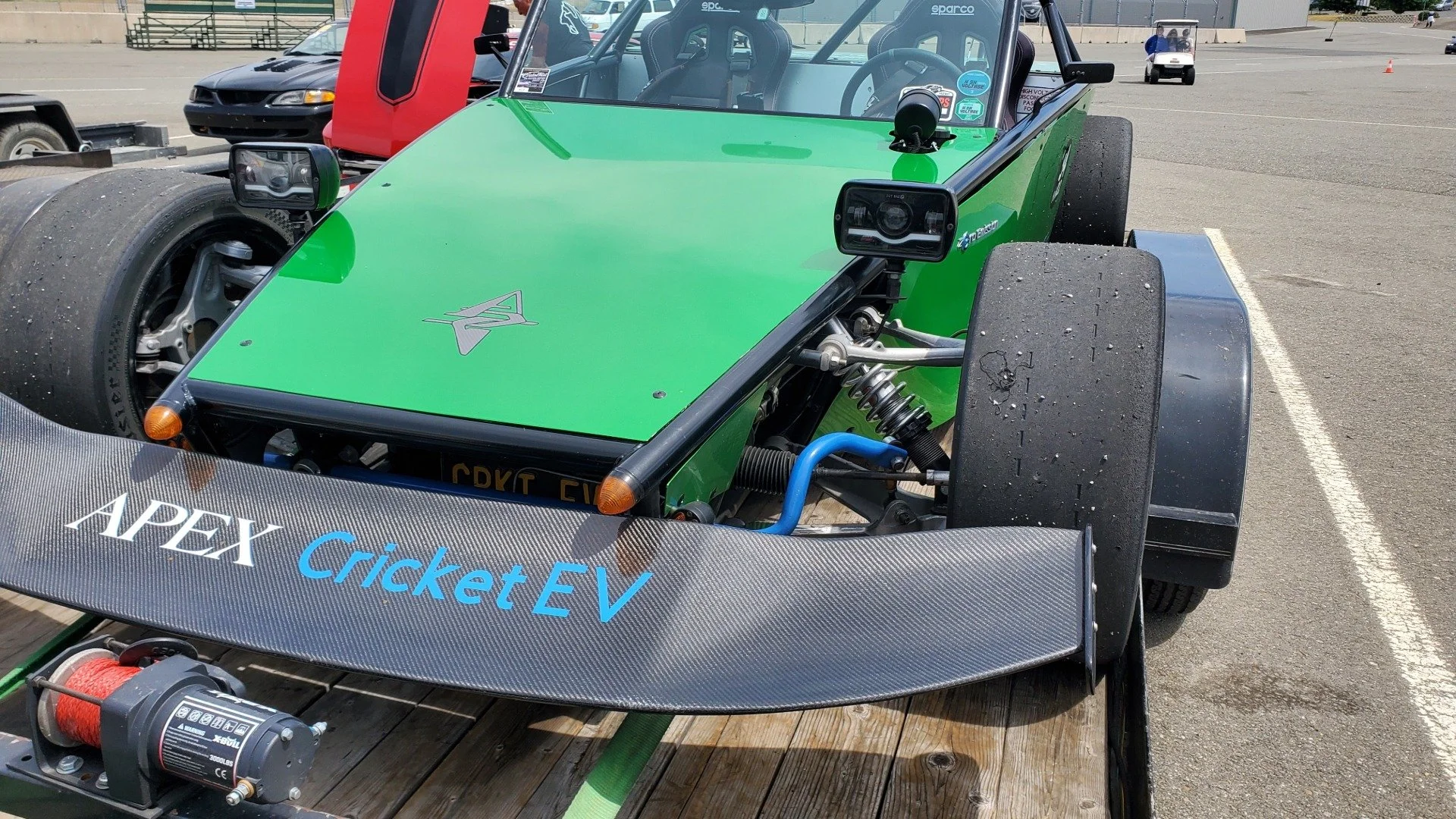 The front of the Apex Cricket race car shows the tube from supported on slick tires and an front wing from aerodynamic grip