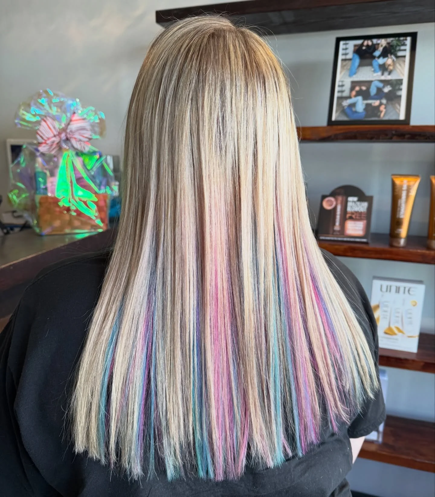 Sareese created this beautiful blonde + vivid for her guest. She started with a full highlight &amp; toner, followed by adding pink and blue vivid colors to the bottom.  Spring color perfected. 🌸🩵