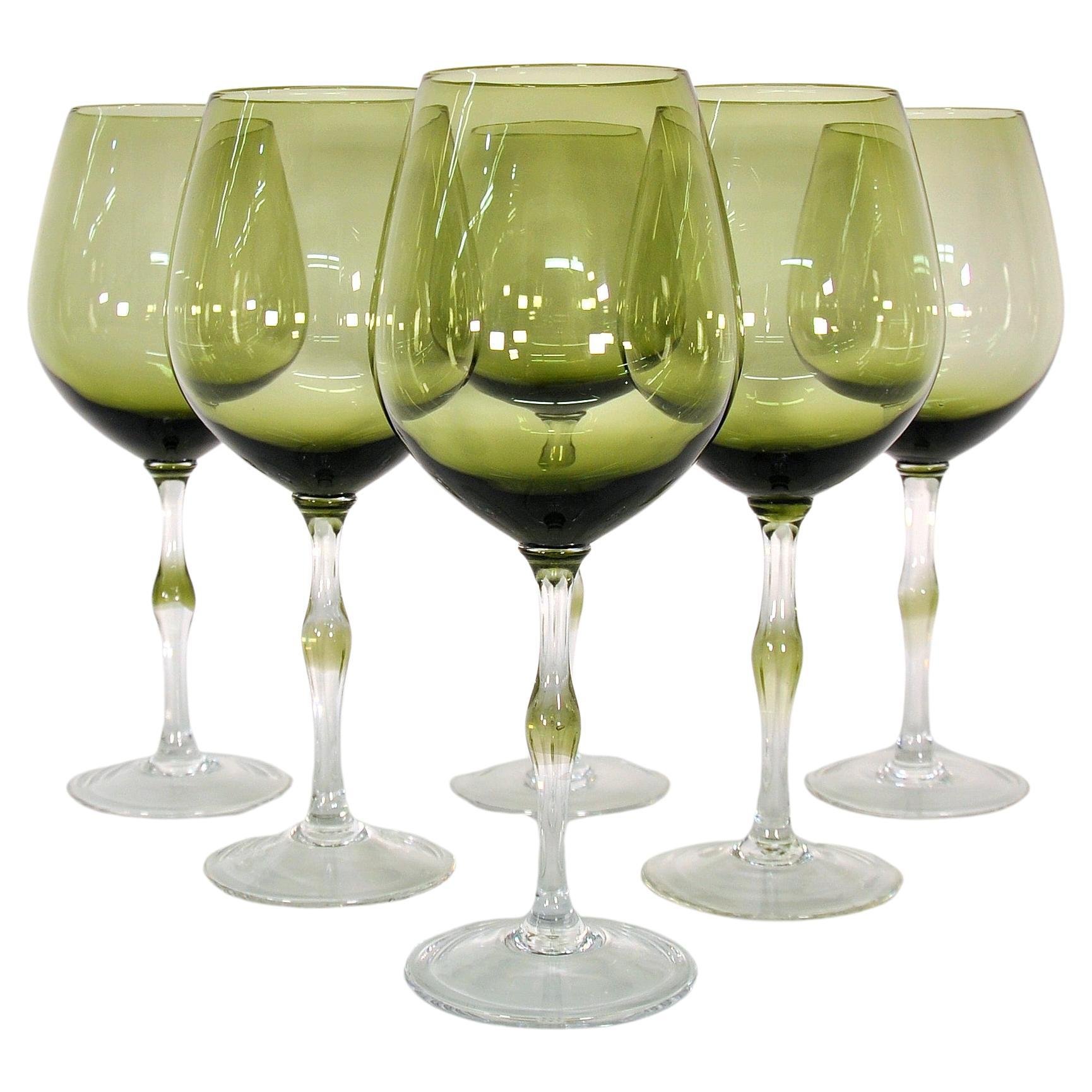 https://images.squarespace-cdn.com/content/v1/628d2996179c184bf054fc91/1687555766451-4A3JG2MZQHPDKN80N5MZ/Olive-Green-Italian-Hand-Blown-Wine-Glasses-1.jpeg
